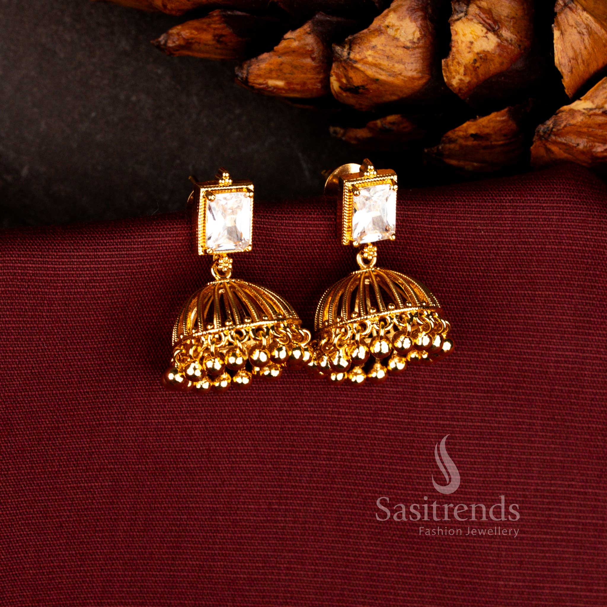 Elegant rectangular stone studded jhumka earrings in white with micro gold plated traditional bell dome design, suitable for festive gatherings, temple ceremonies and cultural occasions – Sasitrends
