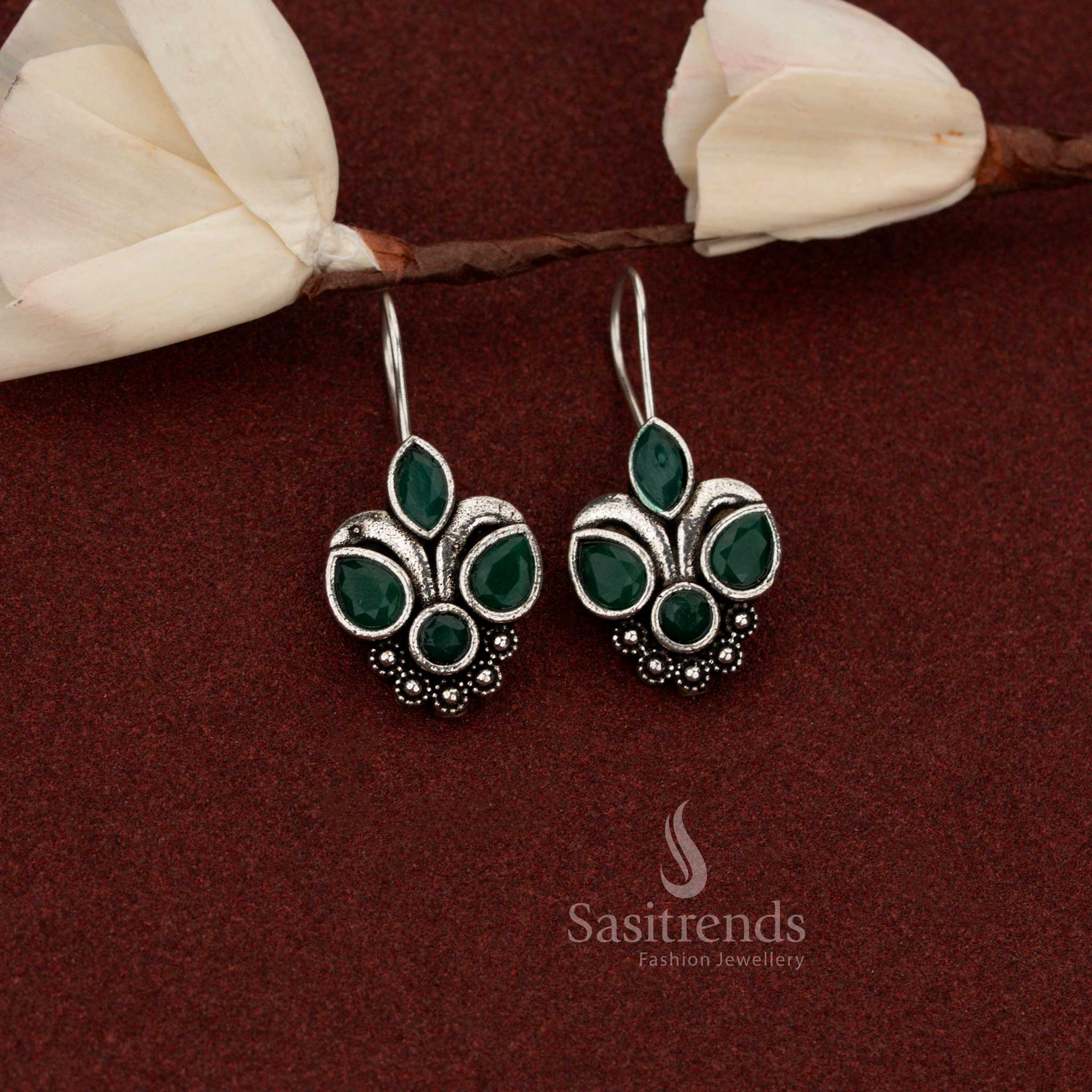 Graceful oxidised silver trifoliate floral stone fish hook earrings in green shade great for kurti styling – Sasitrends