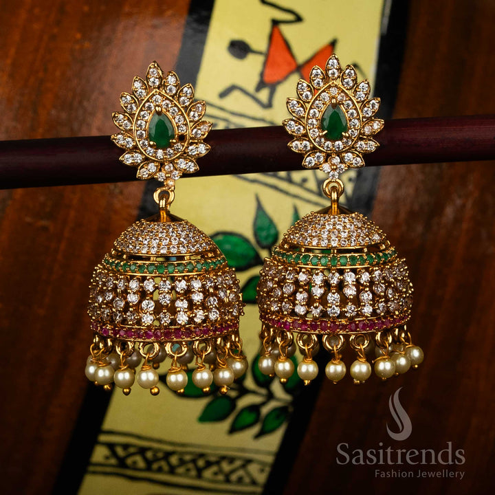Graceful Matte Gold Plated Temple Teardrop AD Stone Studded Jhumka Earrings for Pooja & Traditional Functions