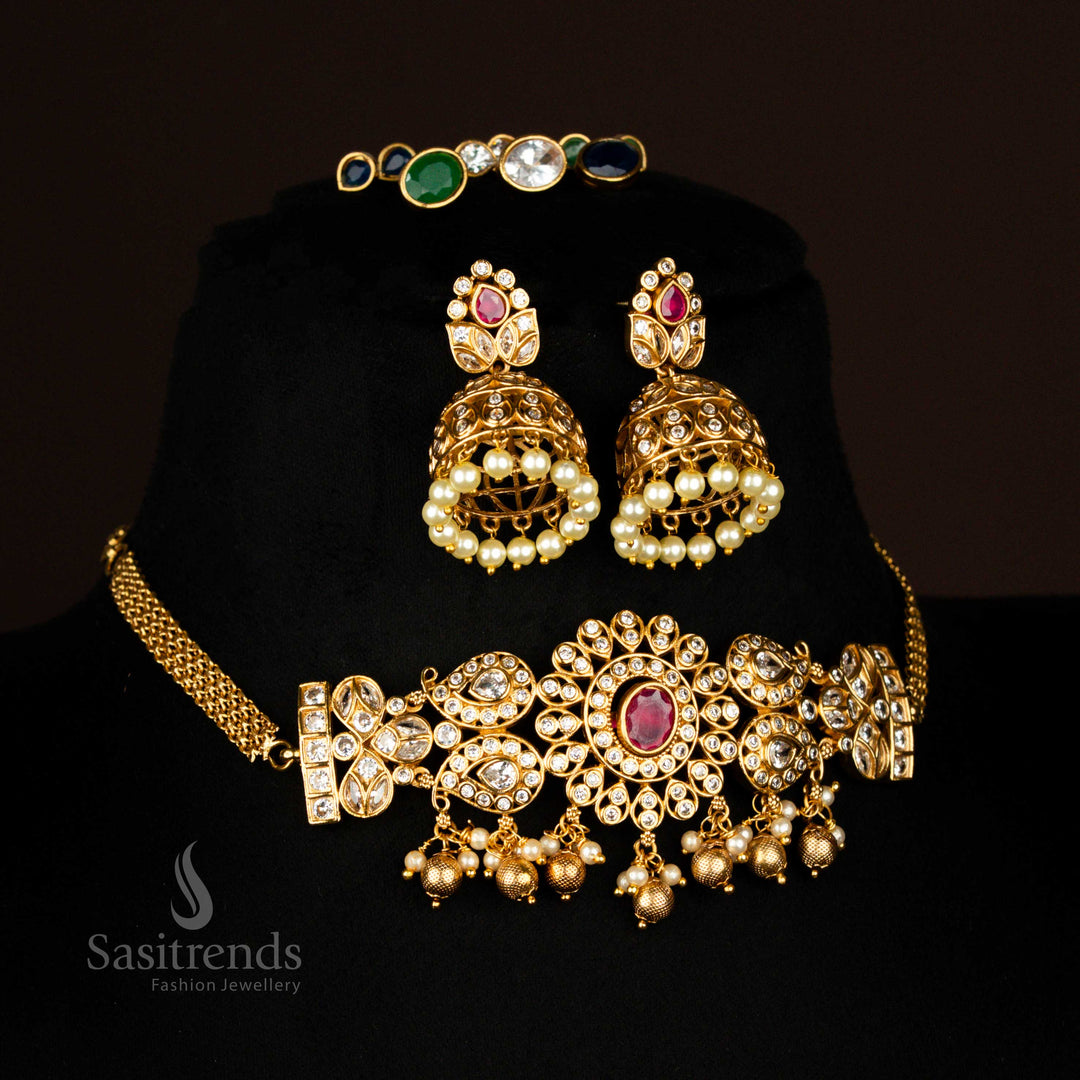 Colourful stone interchangeable AD temple choker in matte gold finish with artistic leaf jhumkas – ideal festive wear jewellery with a creative twist – sasitrends