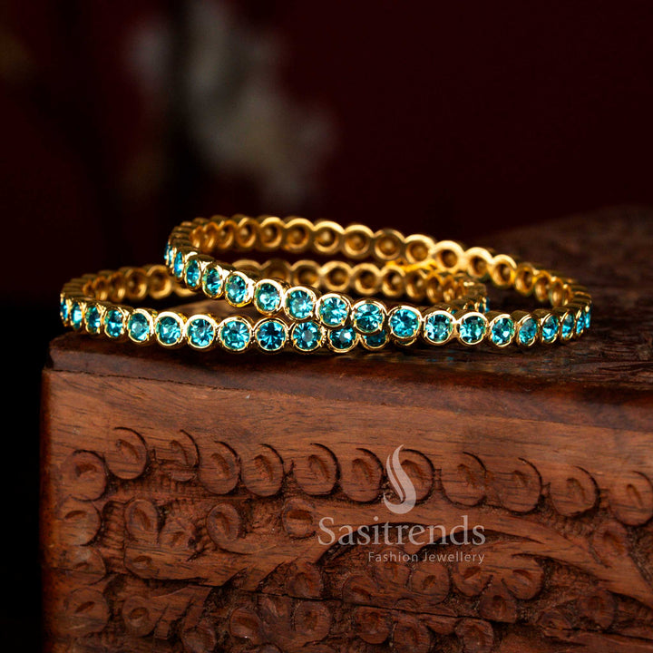 Elegant micro gold plated traditional Impon bangles adorned with sky blue para stones for festive occasions – Sasitrends