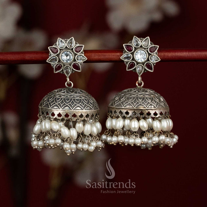 Blended antique oxidised white ruby floral dome jhumka earrings with layered pearls for festive opulence - jewellery - Sasitrends