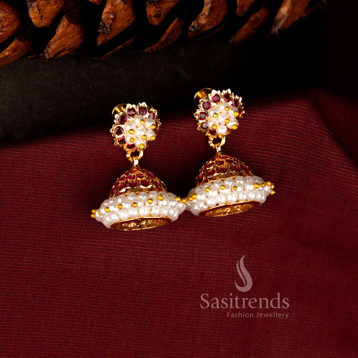 Heritage style earrings in ruby crafted with radiant AD embellishments, central pearl cluster and beautifully curved dome drop – Sasitrends