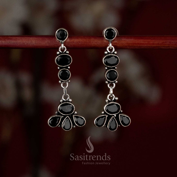 Black oxidised silver earrings designed with linear floral accents and a graceful vertical drop flow – Sasitrends