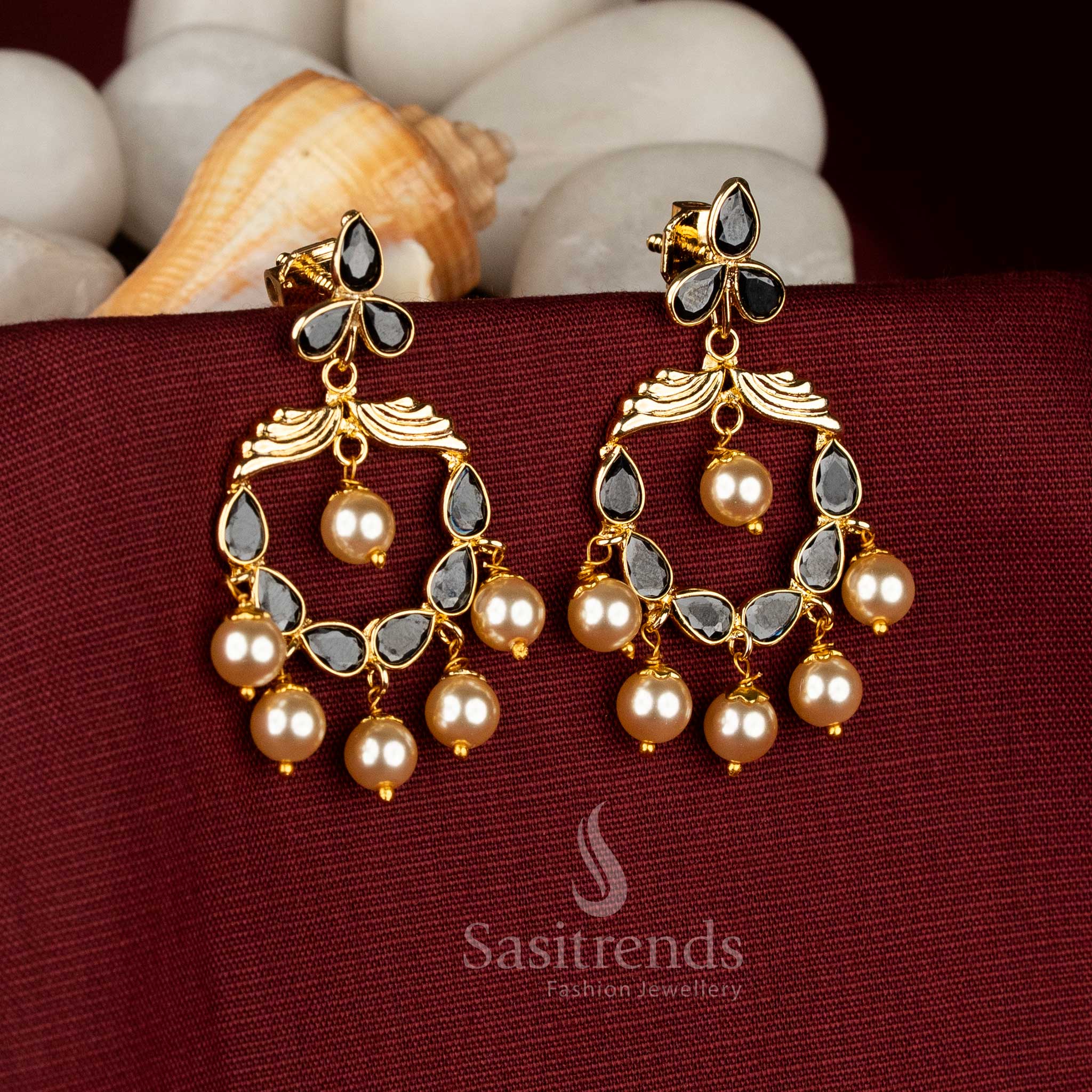 Kundan AD floral crescent earrings accented with pristine pearl detailing delivering dramatic sophistication for cocktail and cultural looks – Sasitrends