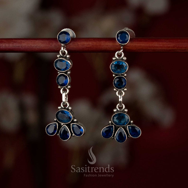 Blue oxidised silver earrings with sculpted blooms arranged in a vertical multi-element drop pattern – Sasitrends