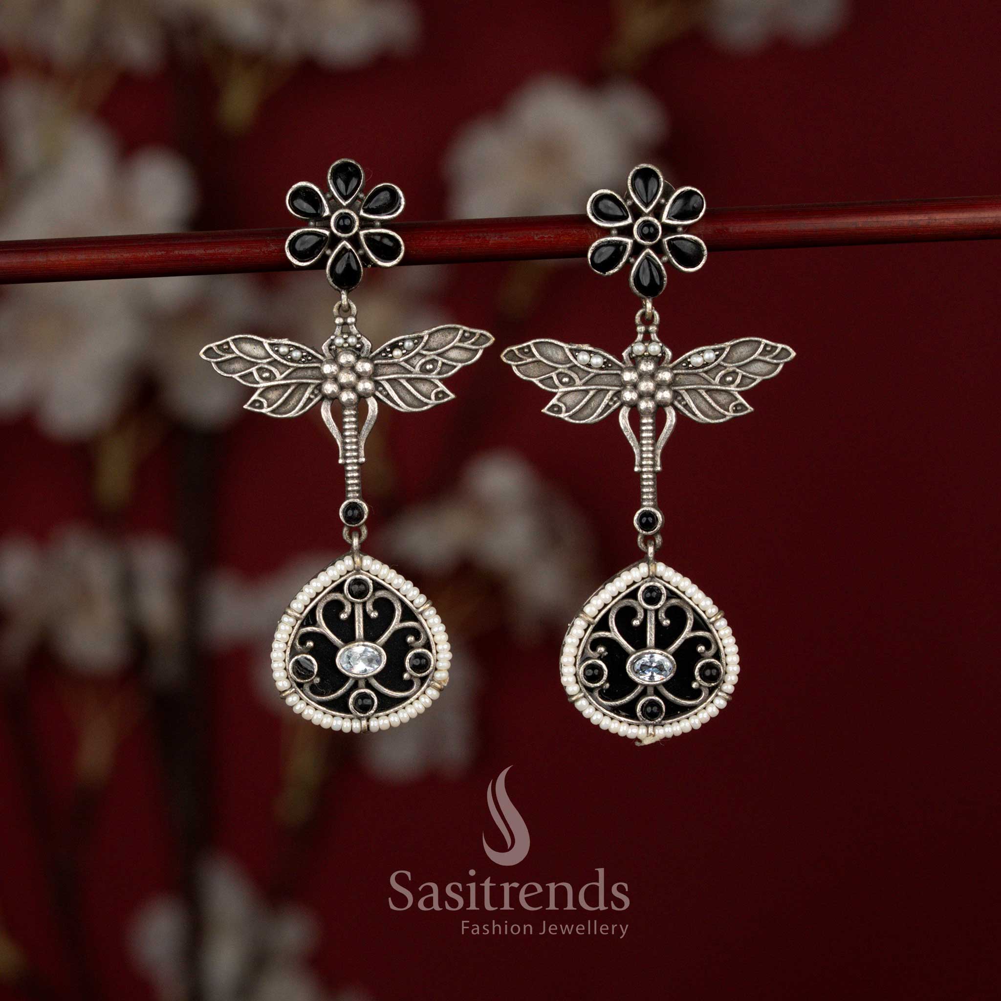 Beautiful Antique Oxidised 6-Petal Floral Dragonfly Wings Teardrop Earrings with Pearl Accents for Navarathri Wear - Sasitrends