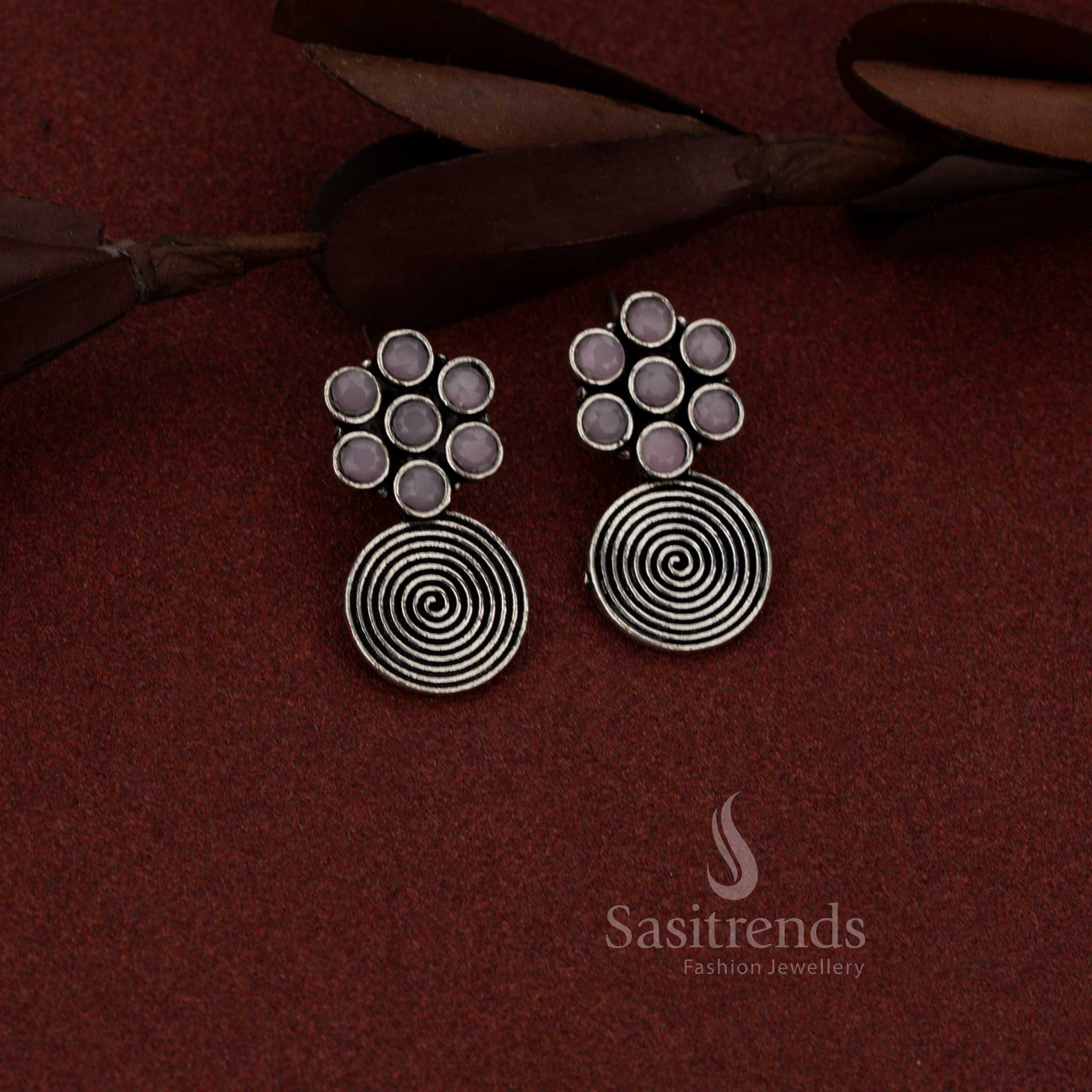 Radiant oxidised silver floral spiral dangler earrings in pink hue suited for casual coffee dates and relaxed outings – Sasitrends