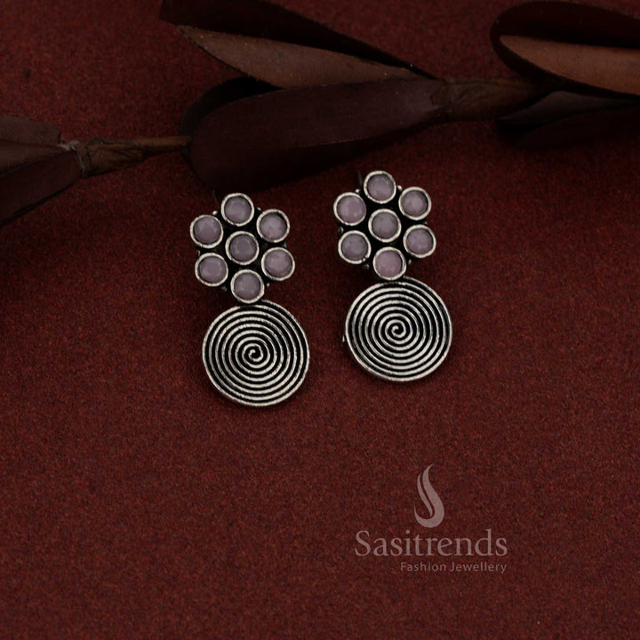 Radiant oxidised silver floral spiral dangler earrings in pink hue suited for casual coffee dates and relaxed outings – Sasitrends