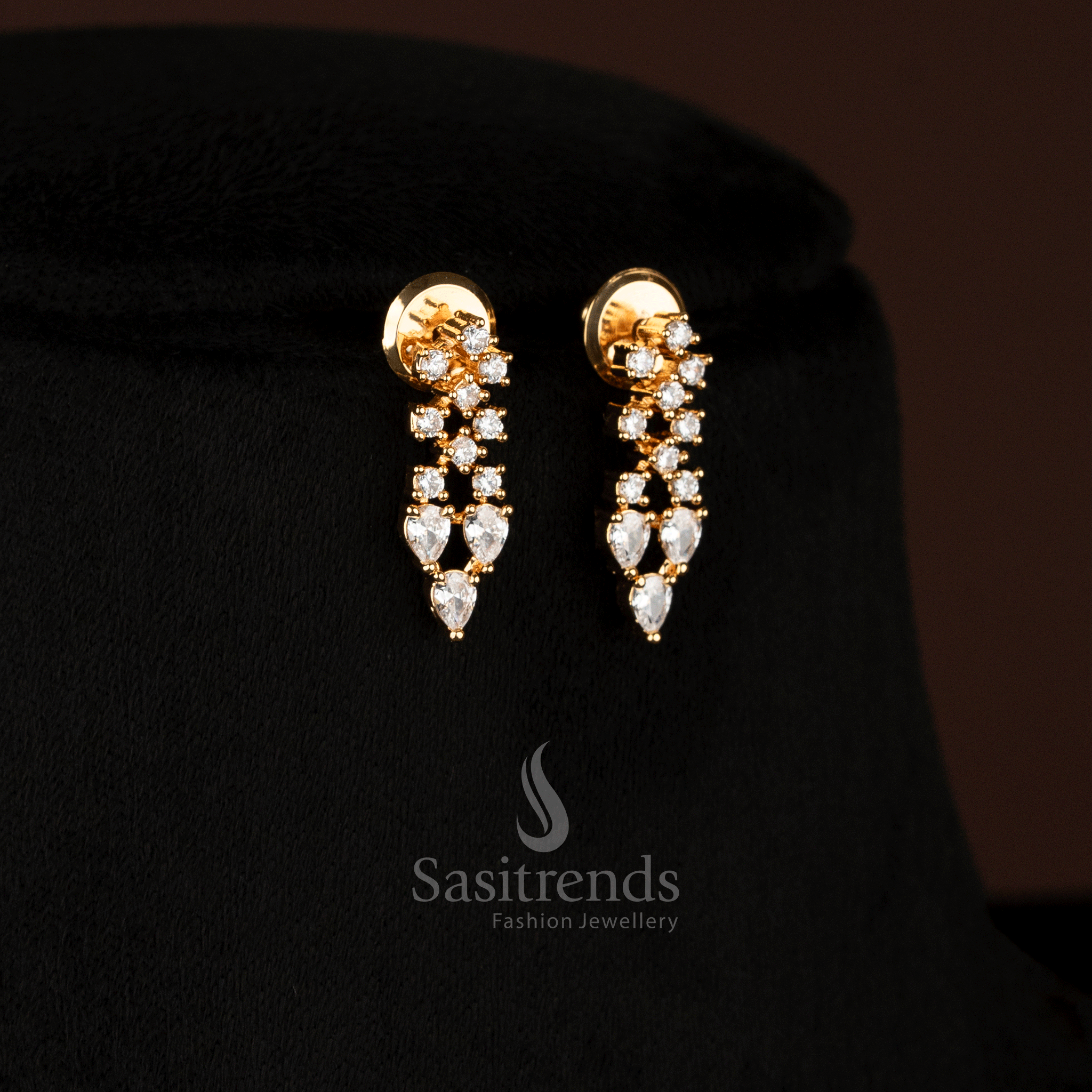 Graceful American Diamond micro gold plated earrings adorned with white marquise teardrop stones, designed to bring festive enchantment to special occasions – Sasitrends