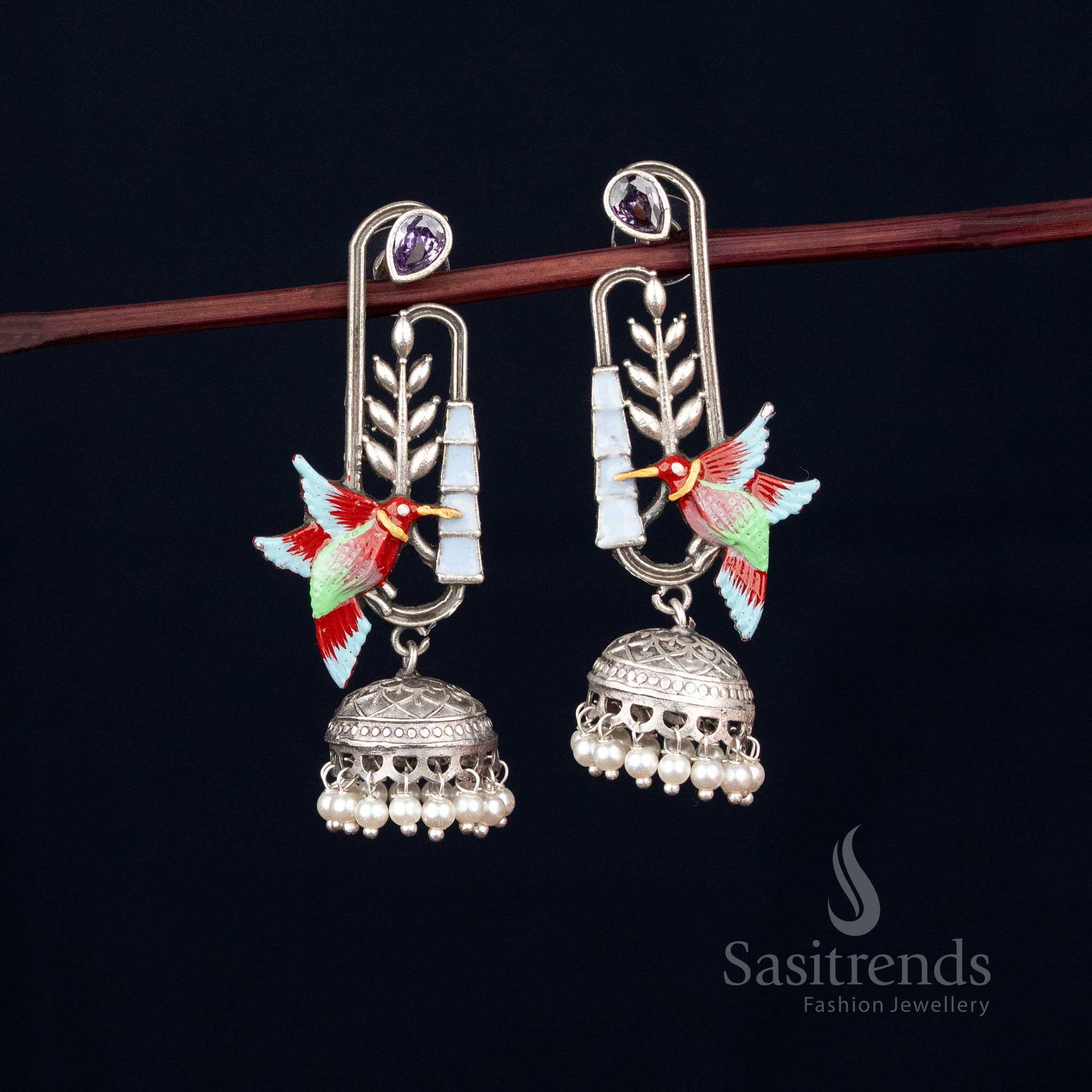 Pearl leaf sway oxidised hummingbird dangler jhumka earrings with artistic painted details for Navaratri grace – Sasitrends