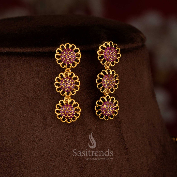 Graceful Eternal Bloom American diamond matte gold plated ruby round flower earrings for sarees and festive occasions – Sasitrends
