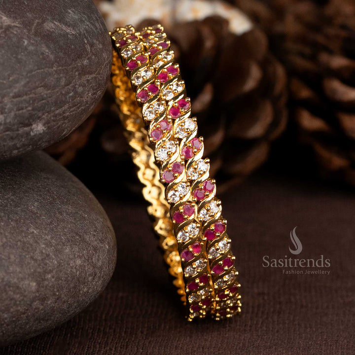 Charming gold plated two line spiral bangles with white-ruby American diamond stones, bringing a refined allure to sarees and celebration-ready ethnic wear – Sasitrends