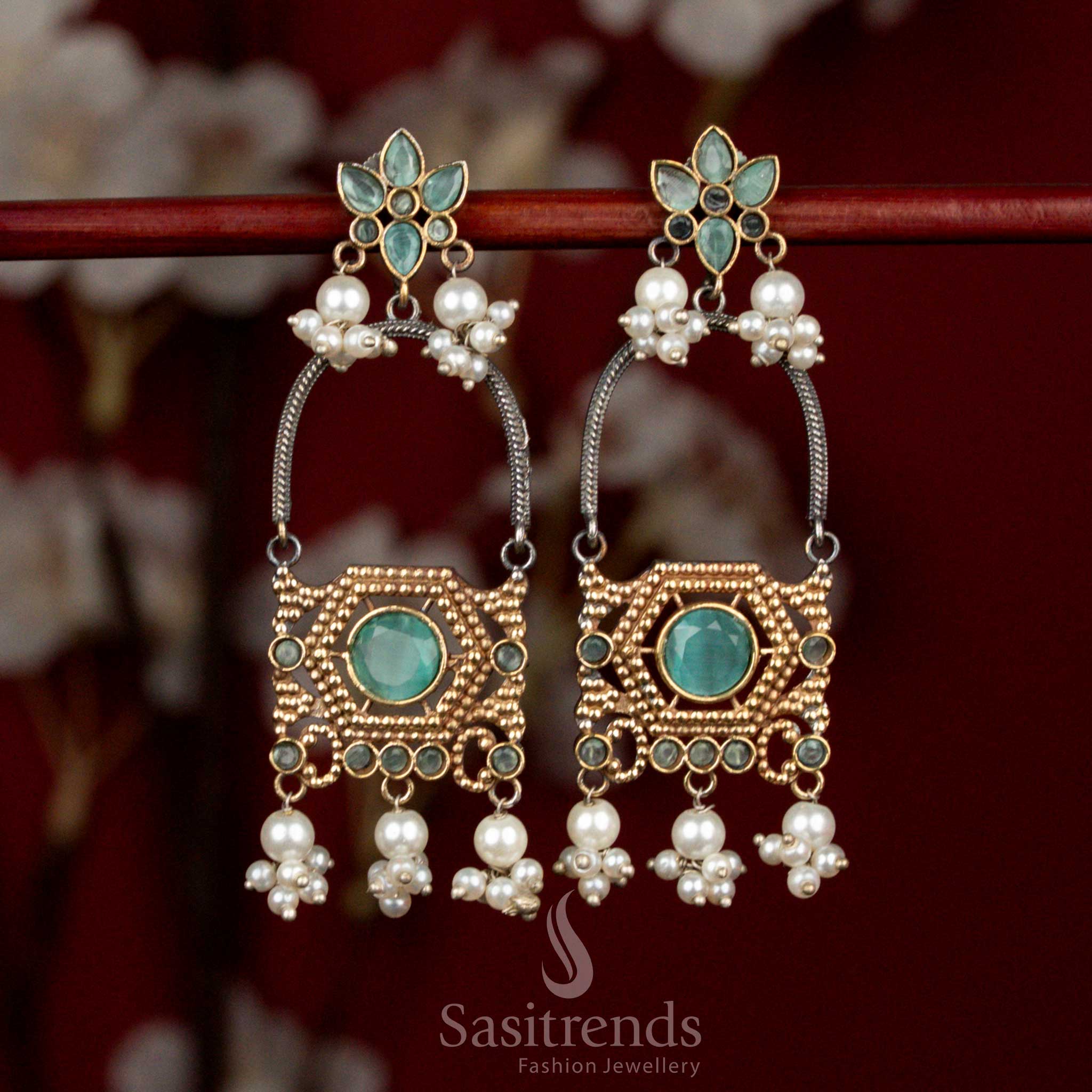 Sophisticated antique oxidised silver earrings featuring mint Monalisa stones, layered floral arch motifs and pearl cluster hangings for refined ethnic wear - Sasitrends