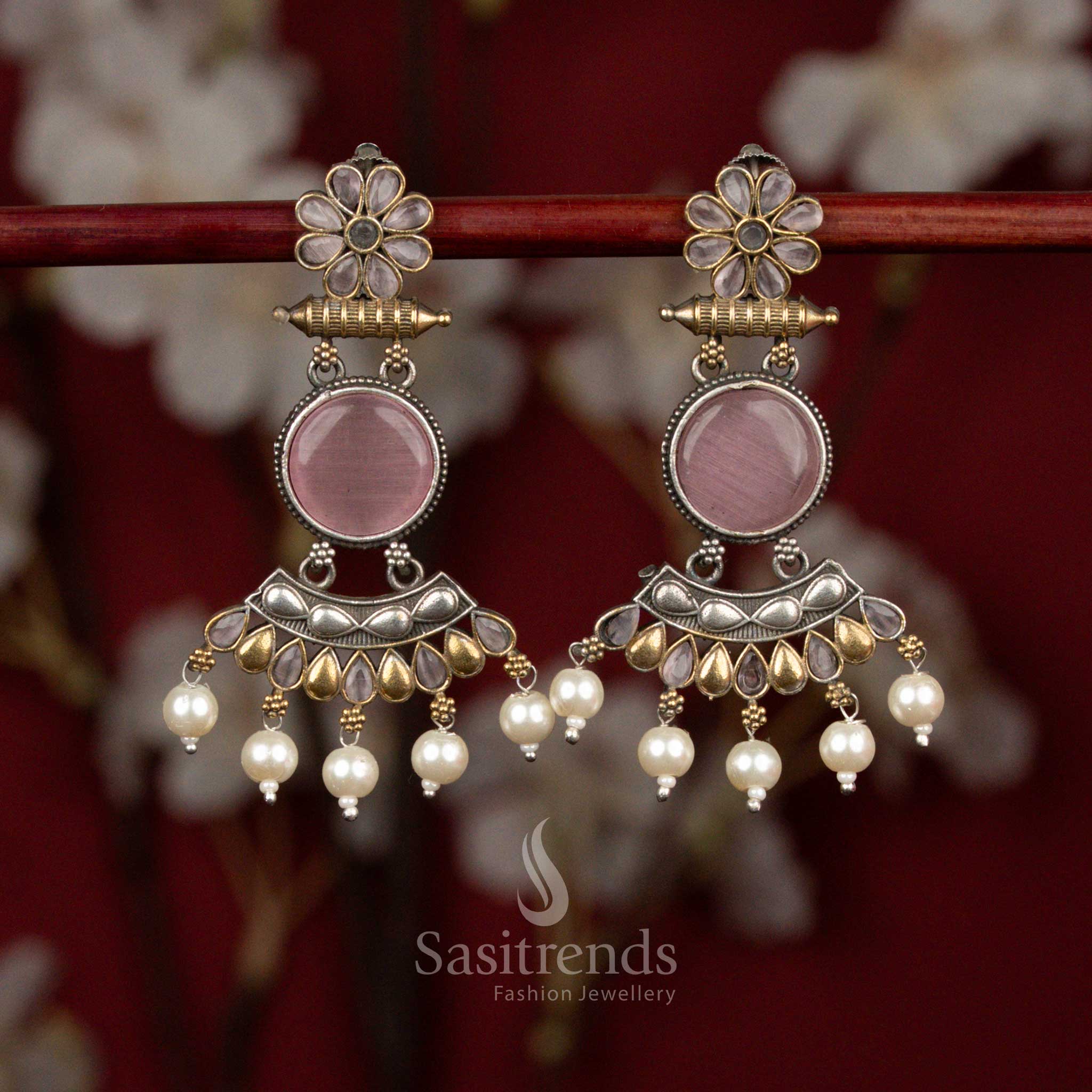 Antique dual tone oxidised silver earrings featuring pink Monalisa stones, sculpted round crescent floral design and pearl drops for festive ethnic occasions - Sasitrends