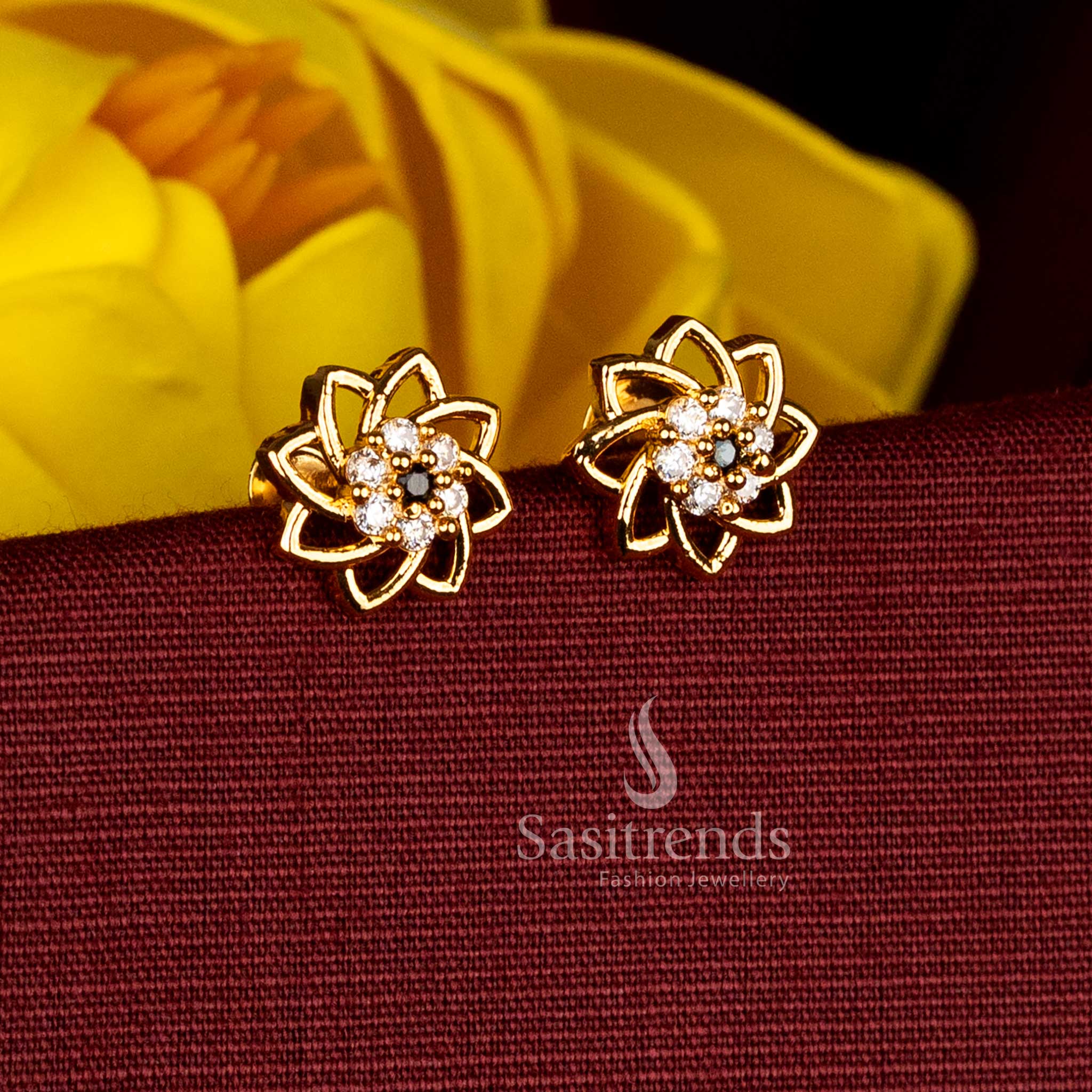 Grand white-black micro gold plated swirl floral AD stud earrings, perfect for temple ceremonies, special festive occasions, and ceremonial traditional attire - Sasitrends
