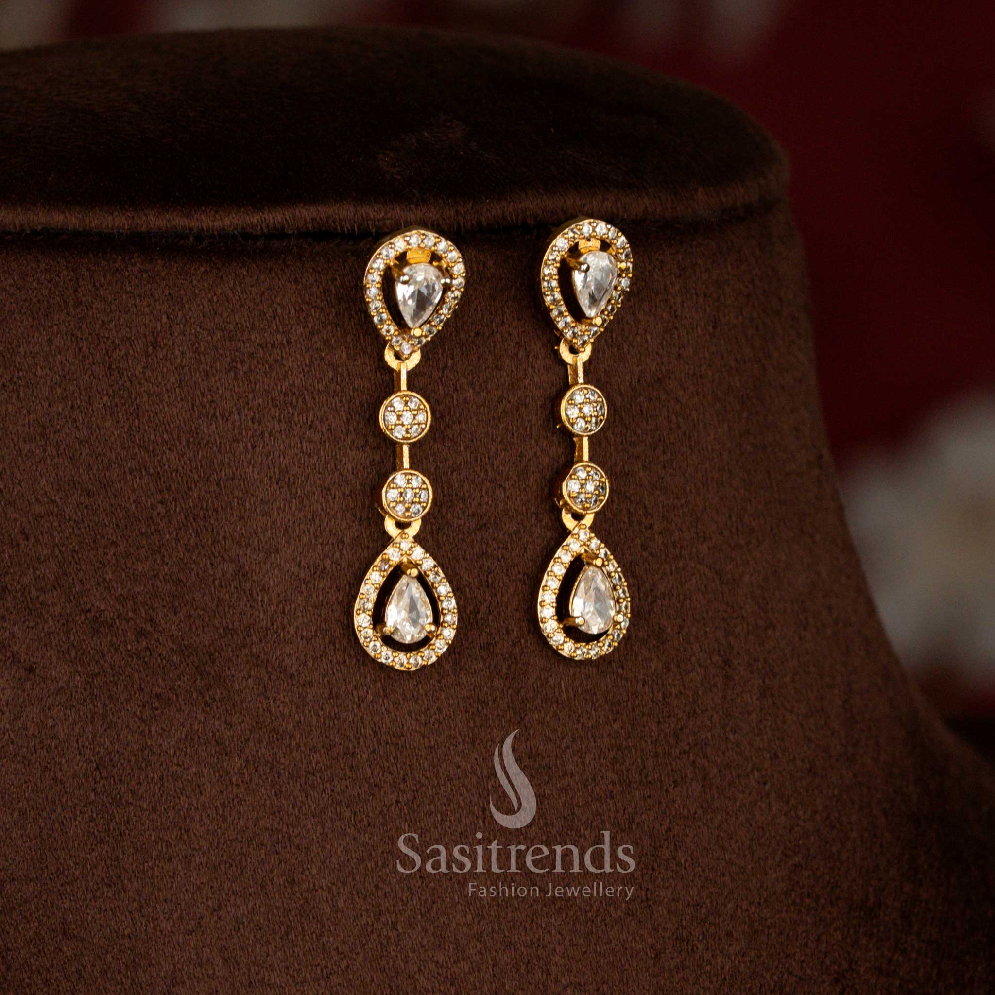 Luminous matte gold floral teardrop earrings with American diamonds in white perfect for receptions and traditional gatherings – Sasitrends