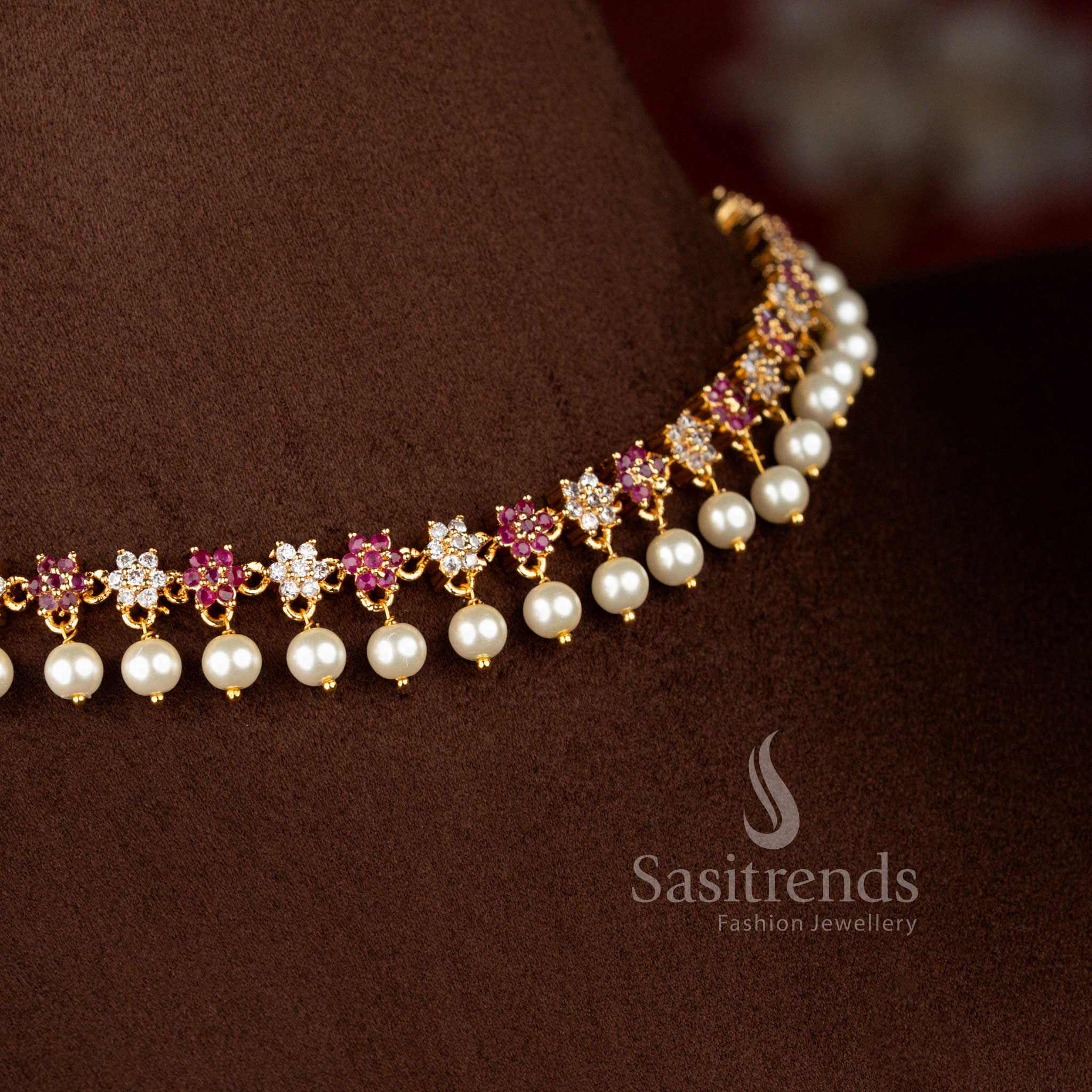 Alluring micro gold plated AD star floral necklace in white-ruby tones with delicate pearl drops, 24K finish – Sasitrends