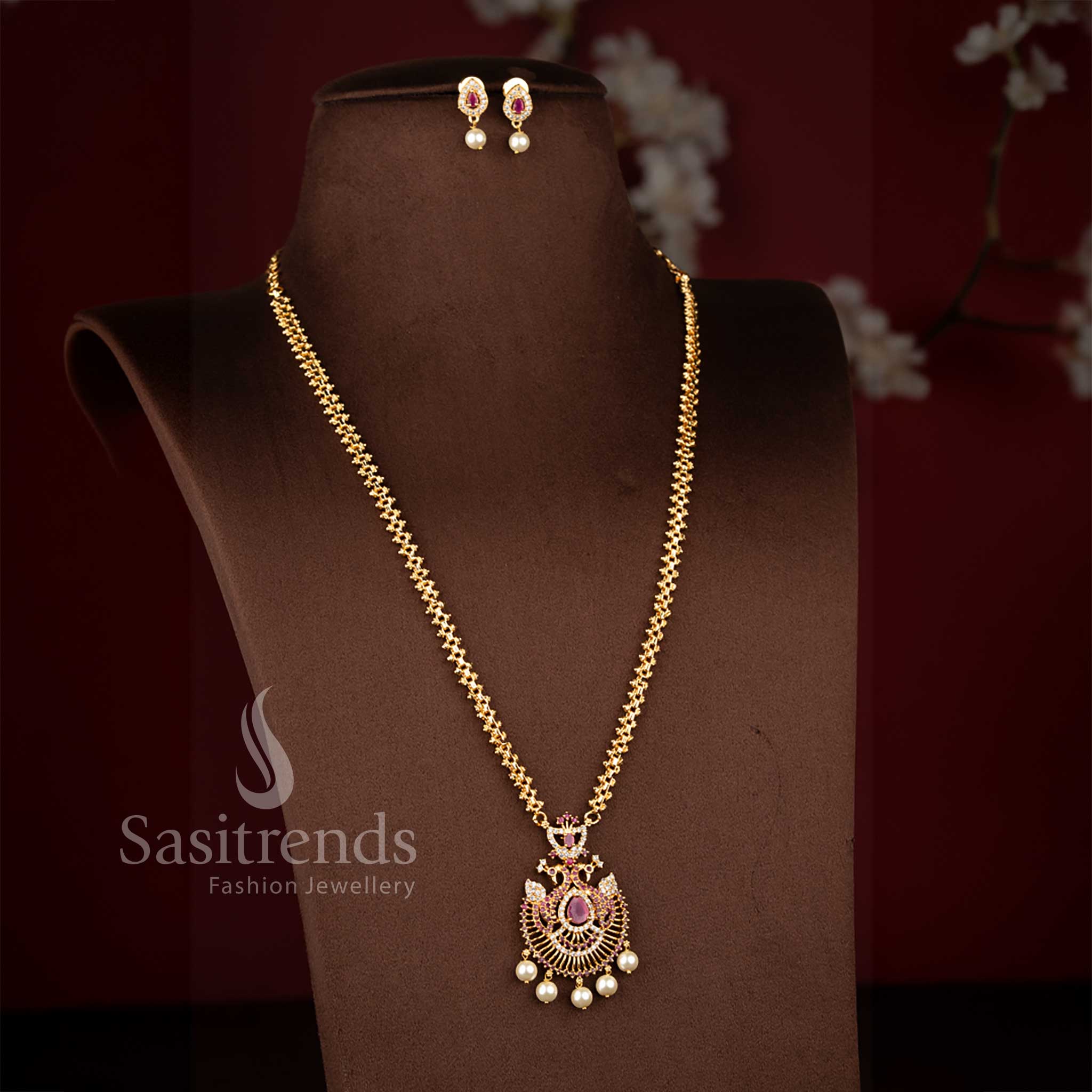 Alluring micro gold plated 2-side Gajiri chain necklace in white-ruby featuring center pear stone peacock pendant and pearl drops – Sasitrends