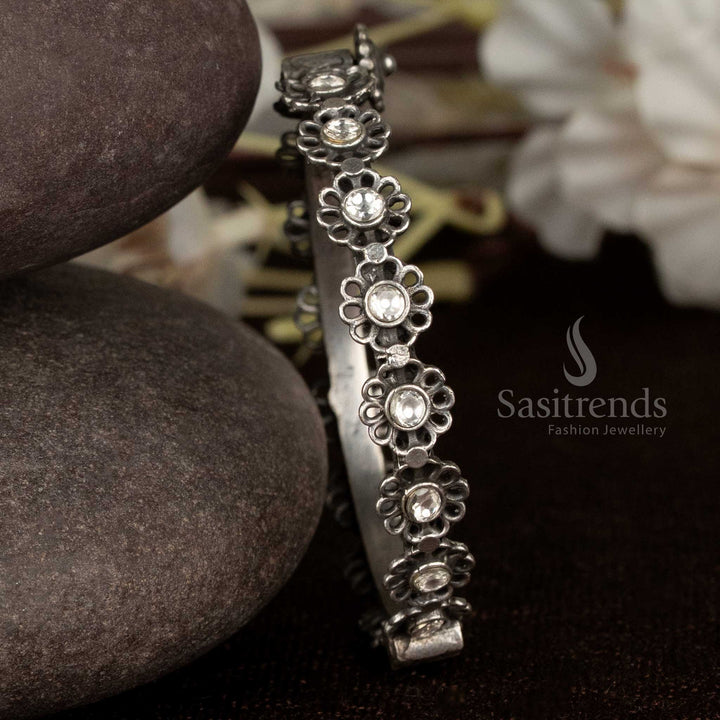 Elegant oxidised bracelet with white crystal floral detail, openable and ideal for modern party wear and designer looks – Sasitrends