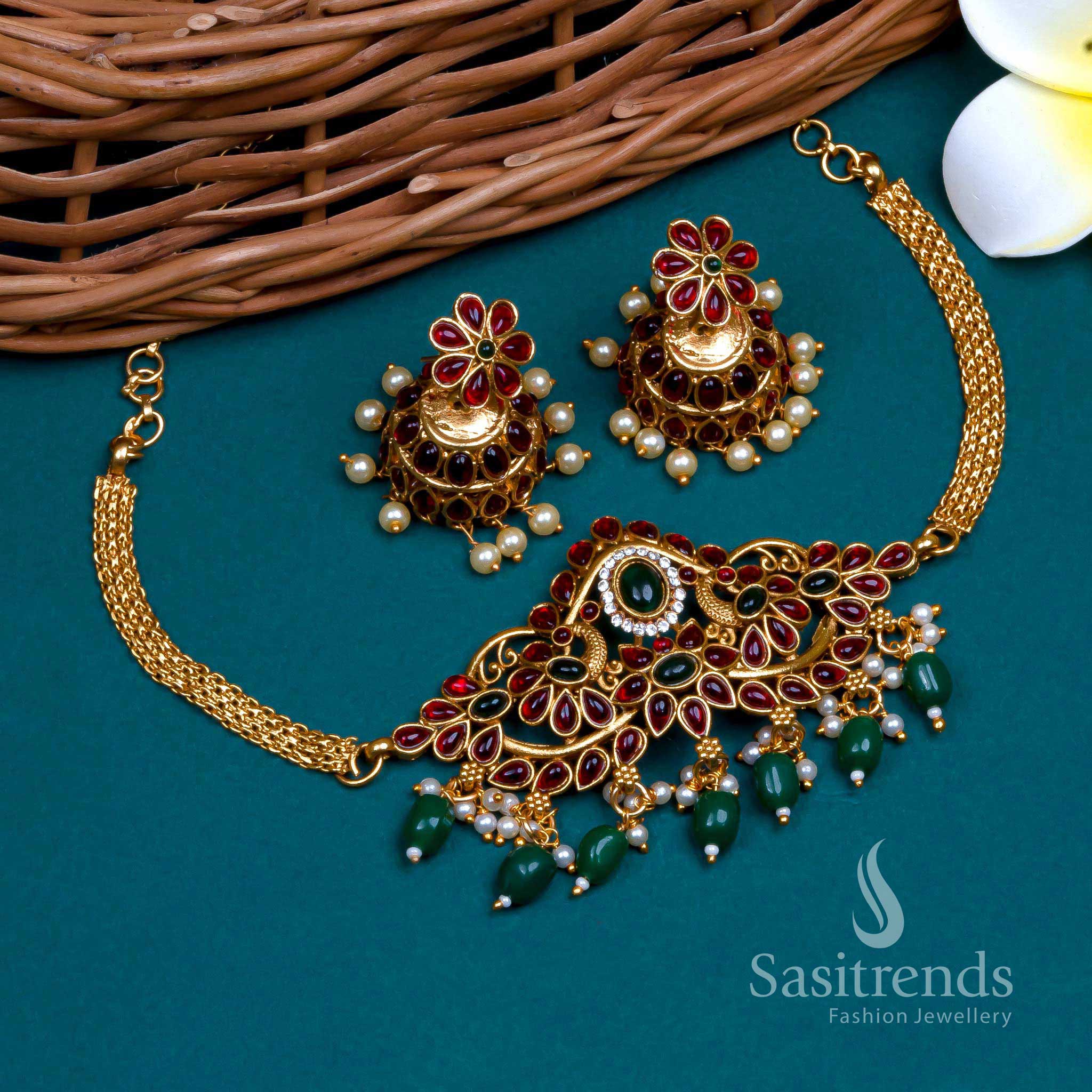Classic emerald plume matte gold plated green-pearl stone studded floral peacock choker jewellery set with graceful pearl detailing for festive and function wear – Sasitrends