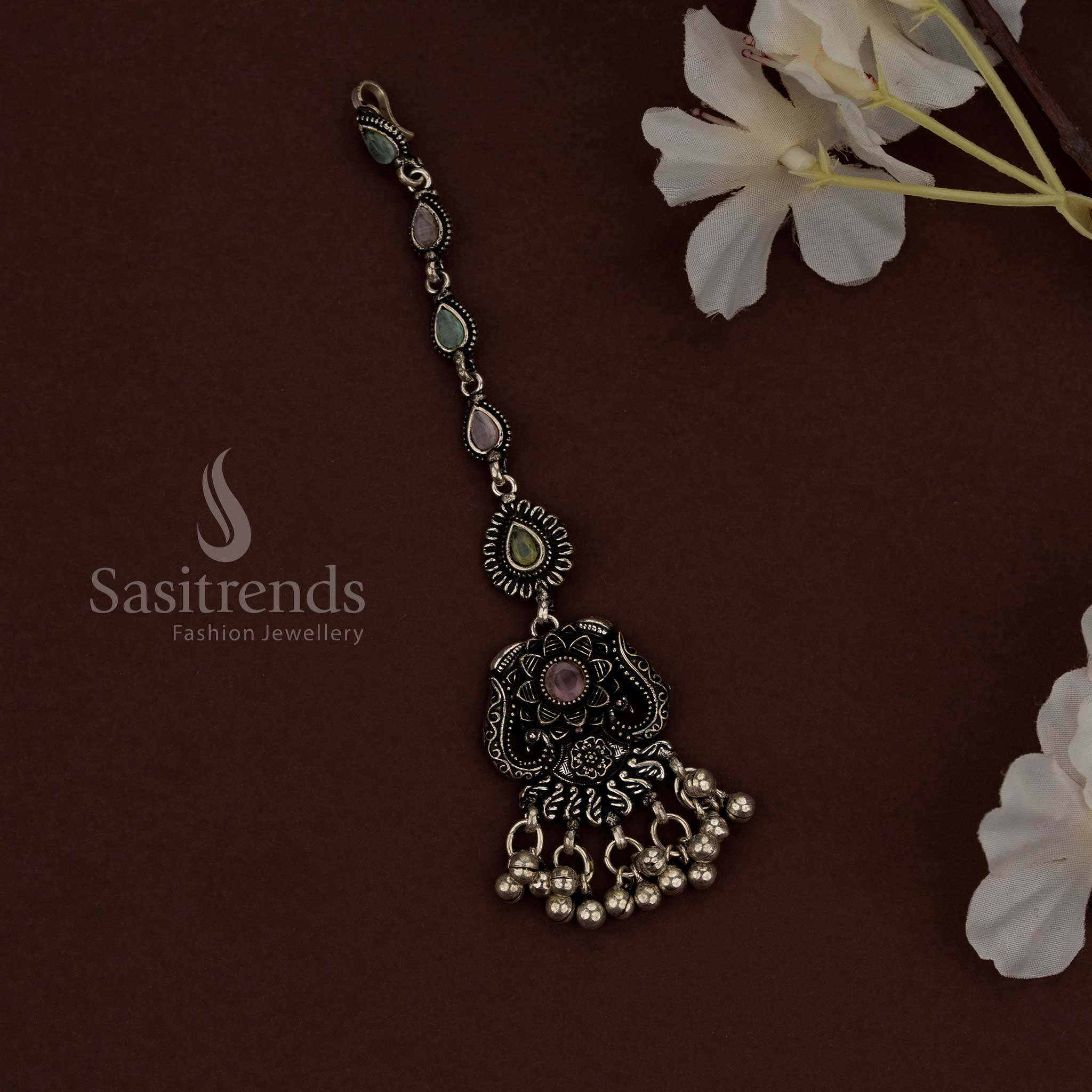 Artisan style Kolapuri oxidised maang tikka designed for ethnic ensembles and cultural events - Sasitrends