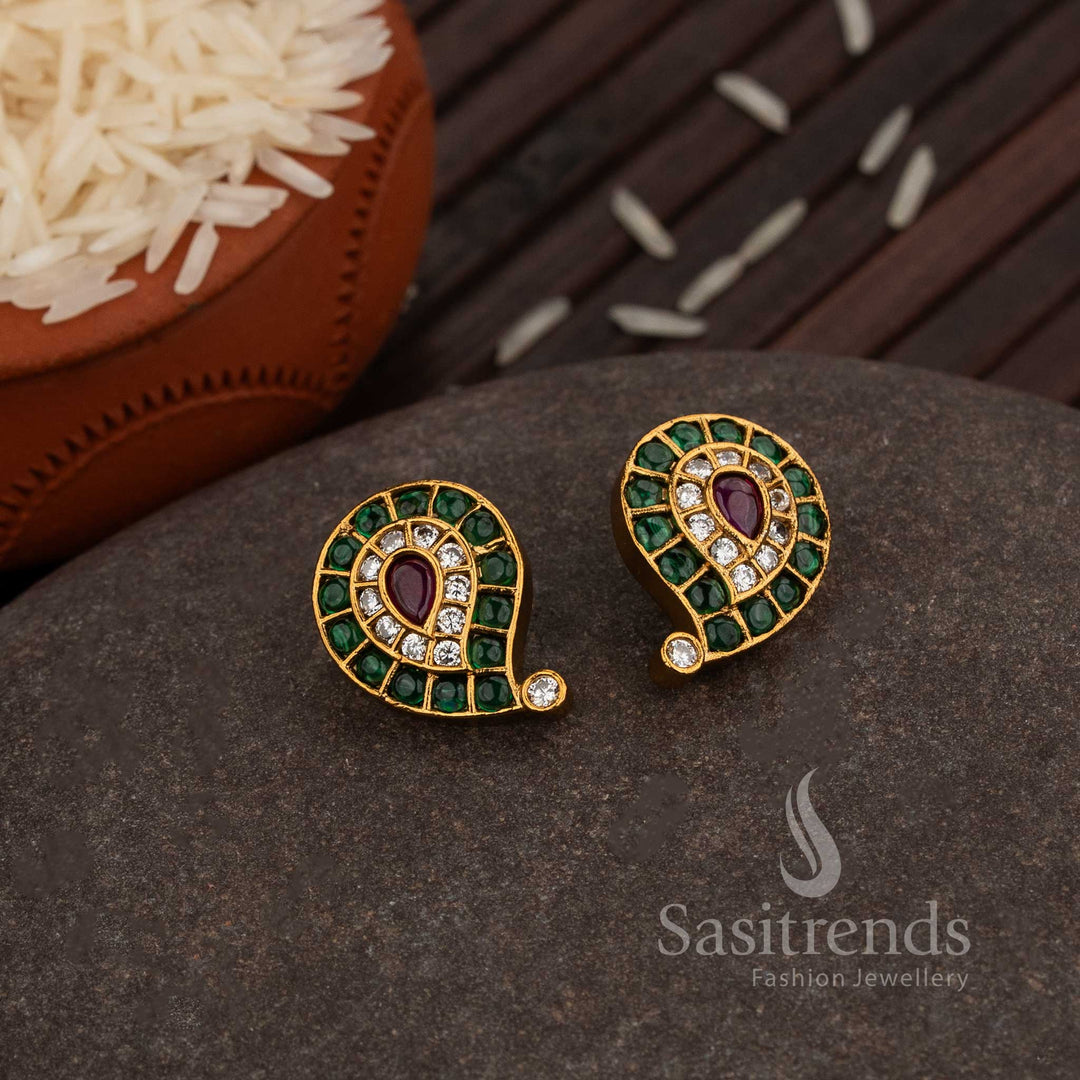 Divine Matte Gold Plated Paisley Stud Earrings Embellished With Green-Ruby AD Stone Detailing, A Trendy Ethnic Jewellery Masterpiece For Festive Celebrations – Sasitrends