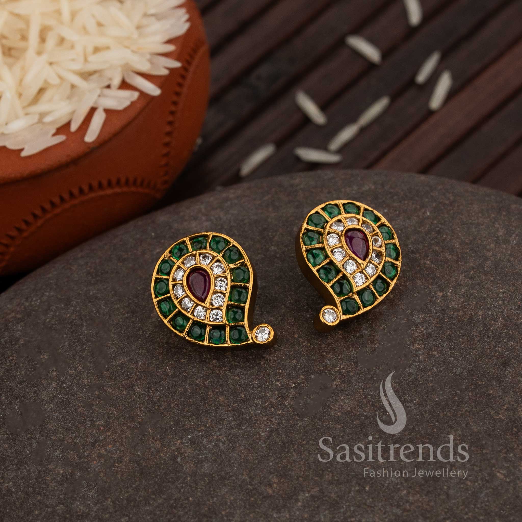 Divine Matte Gold Plated Paisley Stud Earrings Embellished With Green-Ruby AD Stone Detailing, A Trendy Ethnic Jewellery Masterpiece For Festive Celebrations – Sasitrends