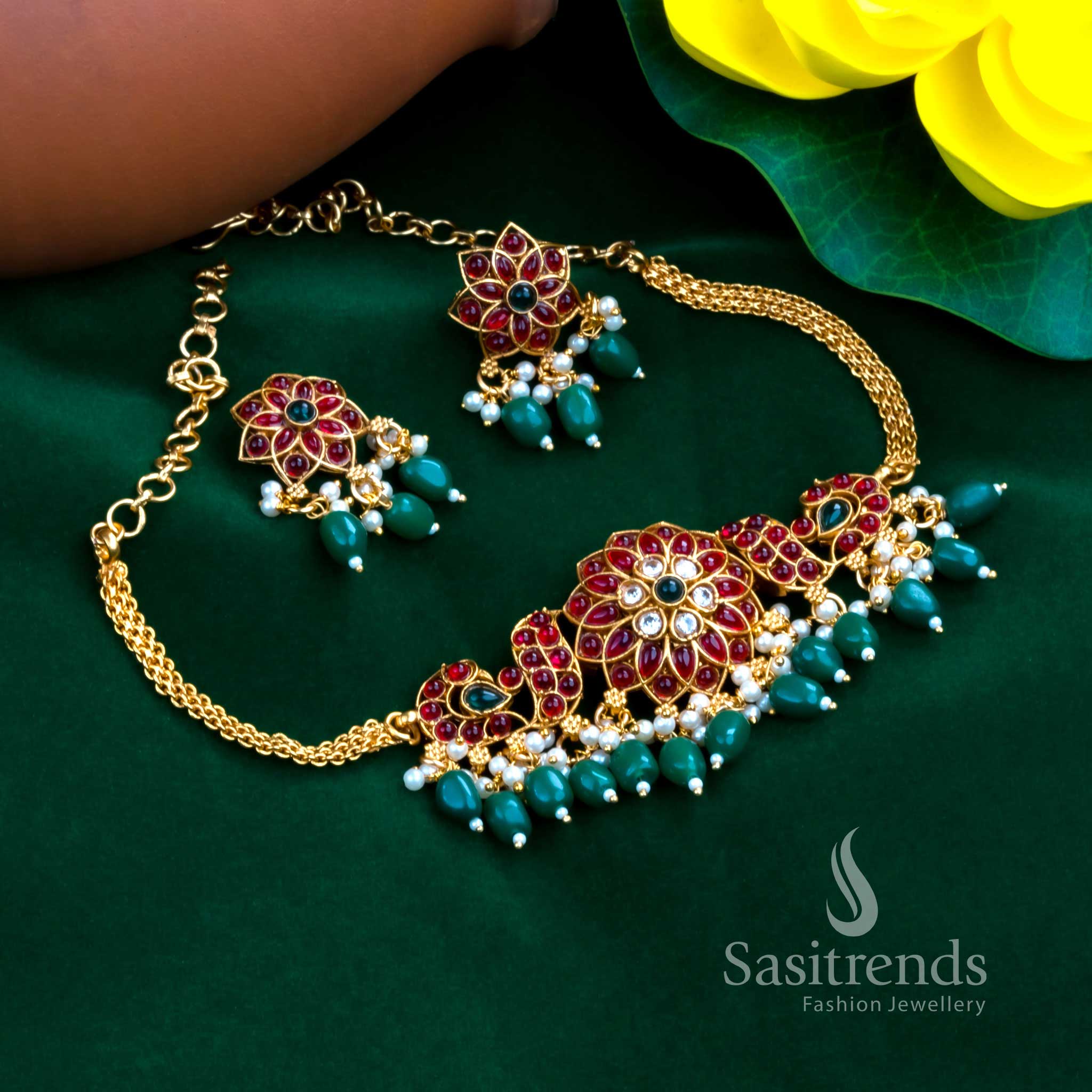 Emeraldwoven classic matte gold plated choker jewellery set detailed with green beads, pearl accents, stone studded flower styling and peacock patterns for refined special event wear – Sasitrends