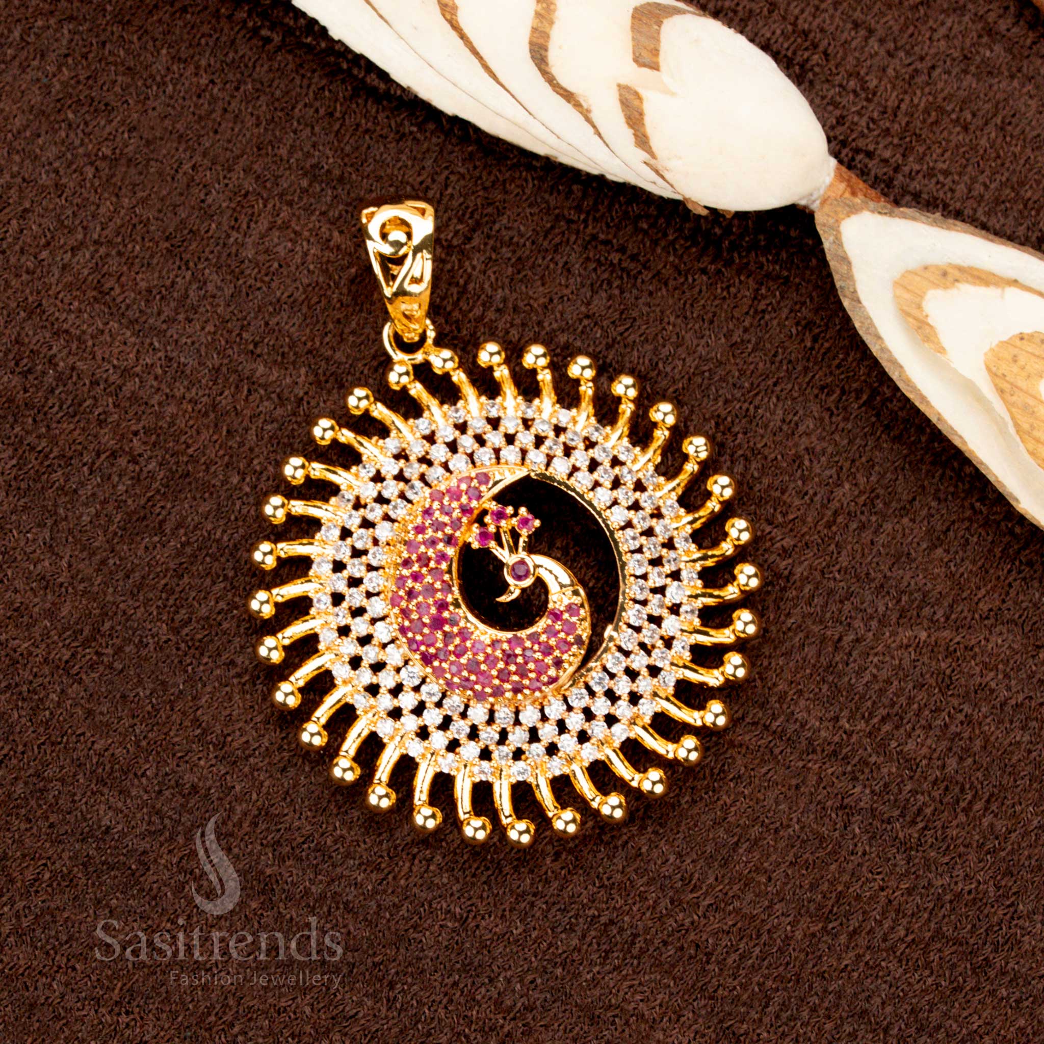 Ornate gold plated peacock design pendant, decorated with sparkling white-ruby AD stones, radiating elegance in ethnic jewellery collections - Sasitrends