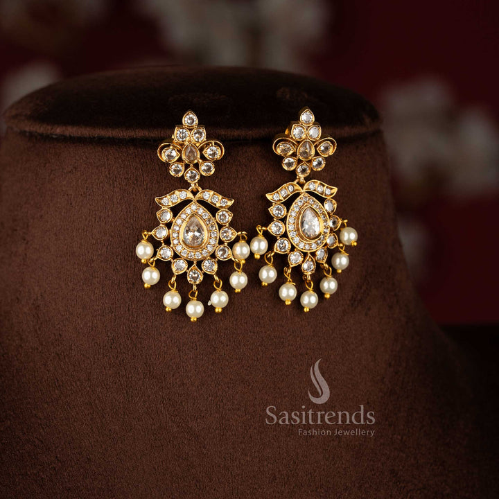 Graceful white floral AD matte gold earrings for women, elegant jewellery for festive occasions - Sasitrends