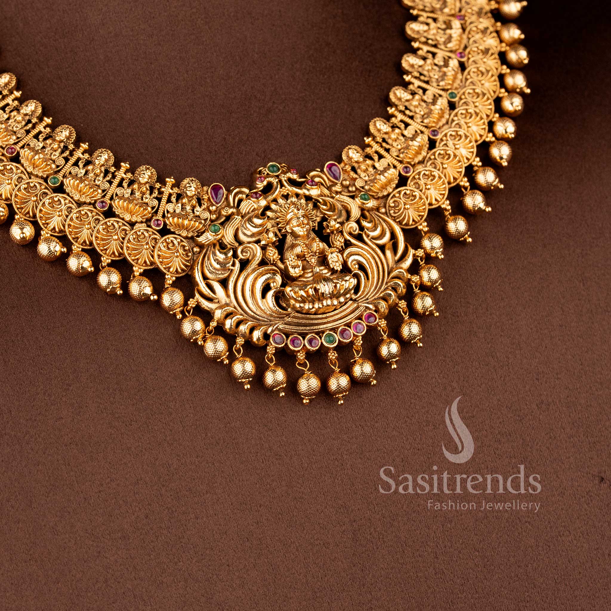 Grand Temple Jewellery Set for brides featuring an expansive Lakshmi deity pendant and a wide floral coin choker band - Sasitrends
