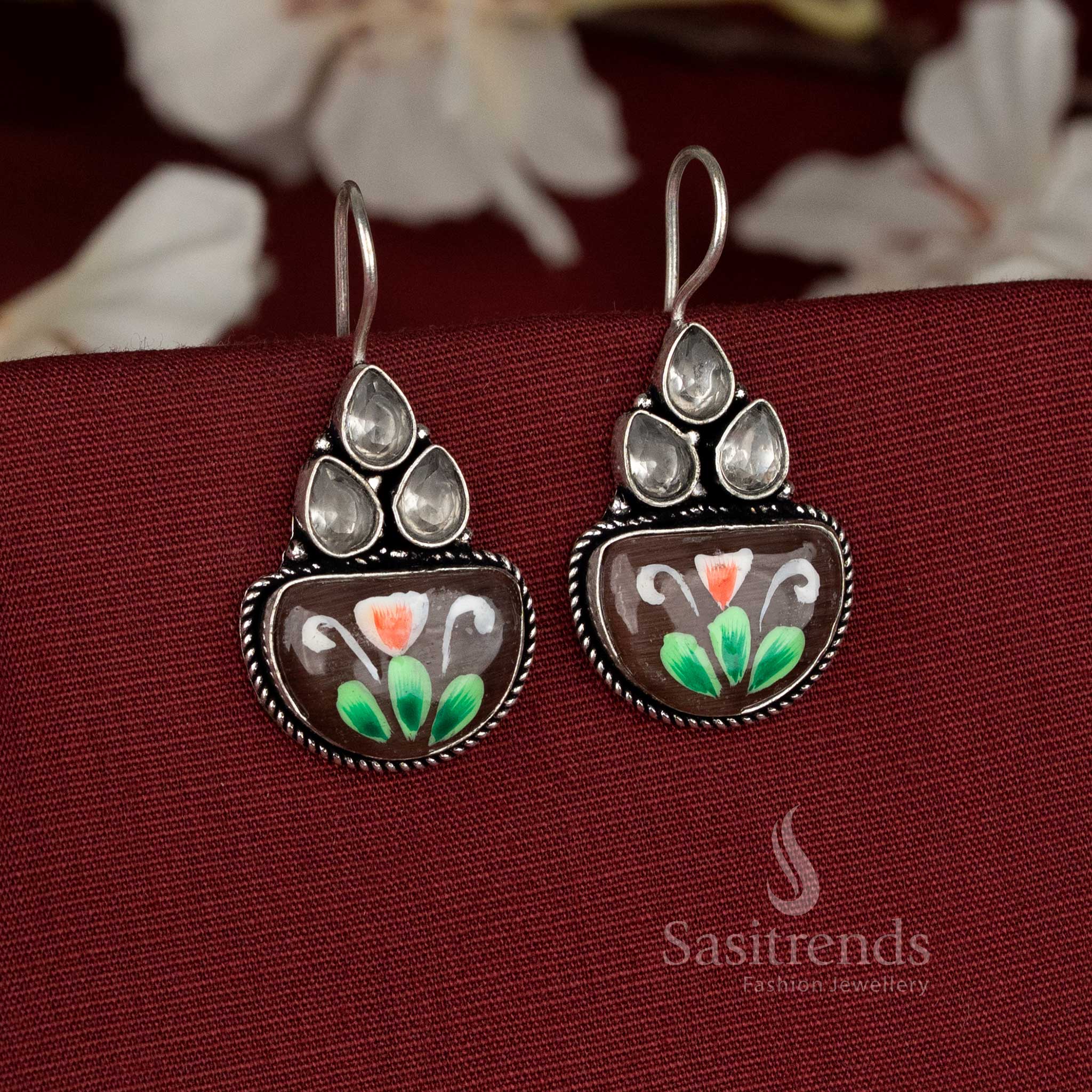 Earthy tone oxidised earrings embedded with brown Monalisa stones and classic floral brush accents – Sasitrends