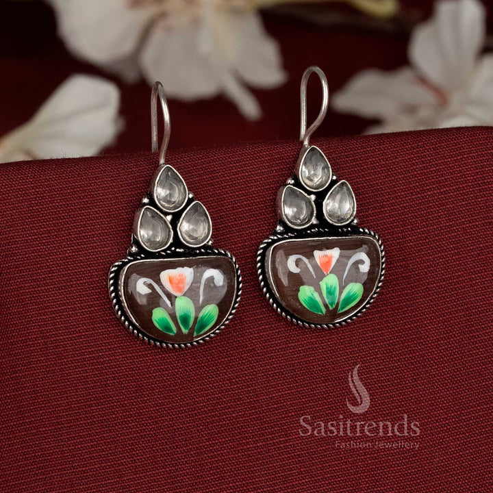 Earthy tone oxidised earrings embedded with brown Monalisa stones and classic floral brush accents – Sasitrends