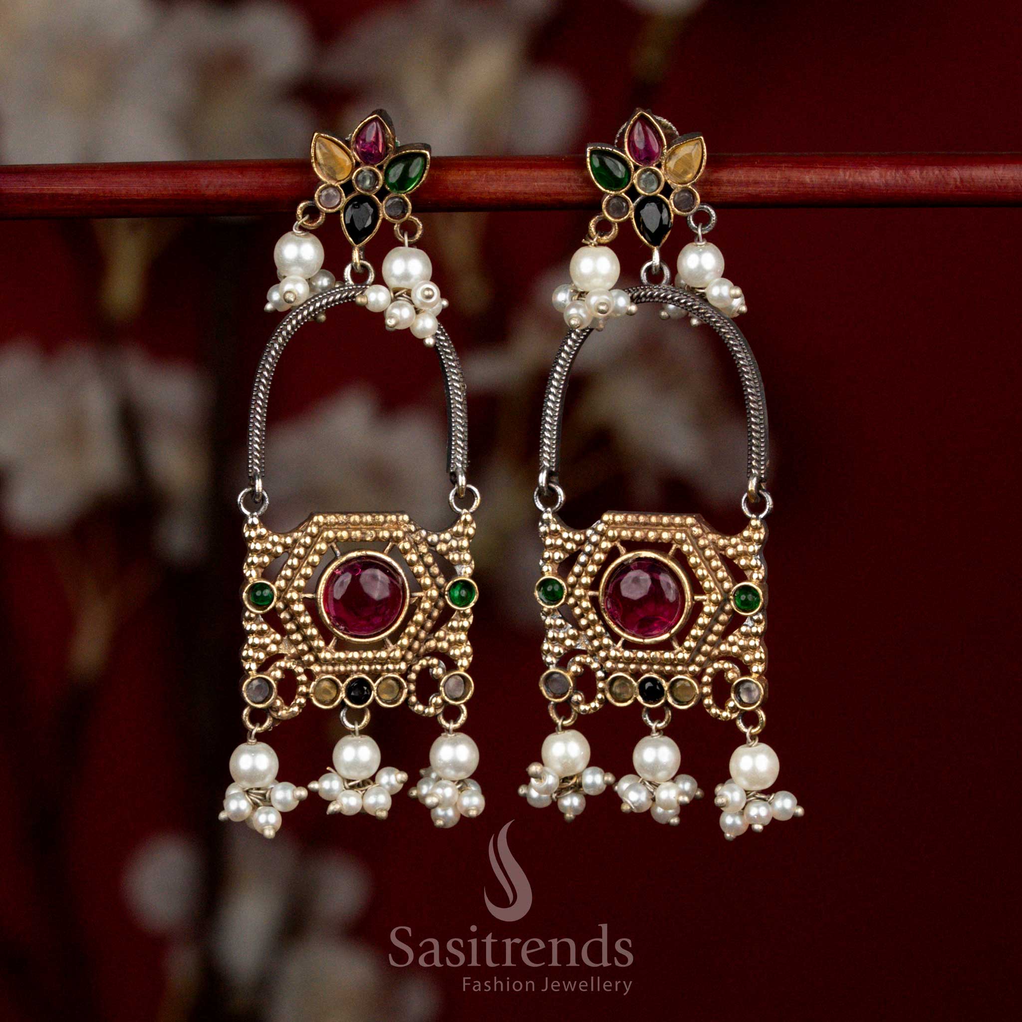 Vibrant dual tone oxidised silver earrings adorned with multicolour Monalisa stones, layered floral arch motifs and pearl cluster drops for festive ethnic wear - Sasitrends