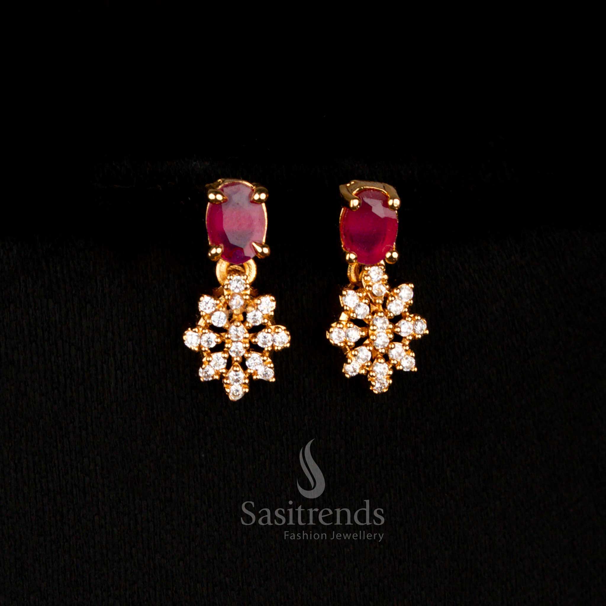 Radiant festival-ready micro gold plated American Diamond earrings set with vibrant white-ruby coloured oval stones, giving a lively designer accent for grand celebrations – Sasitrends