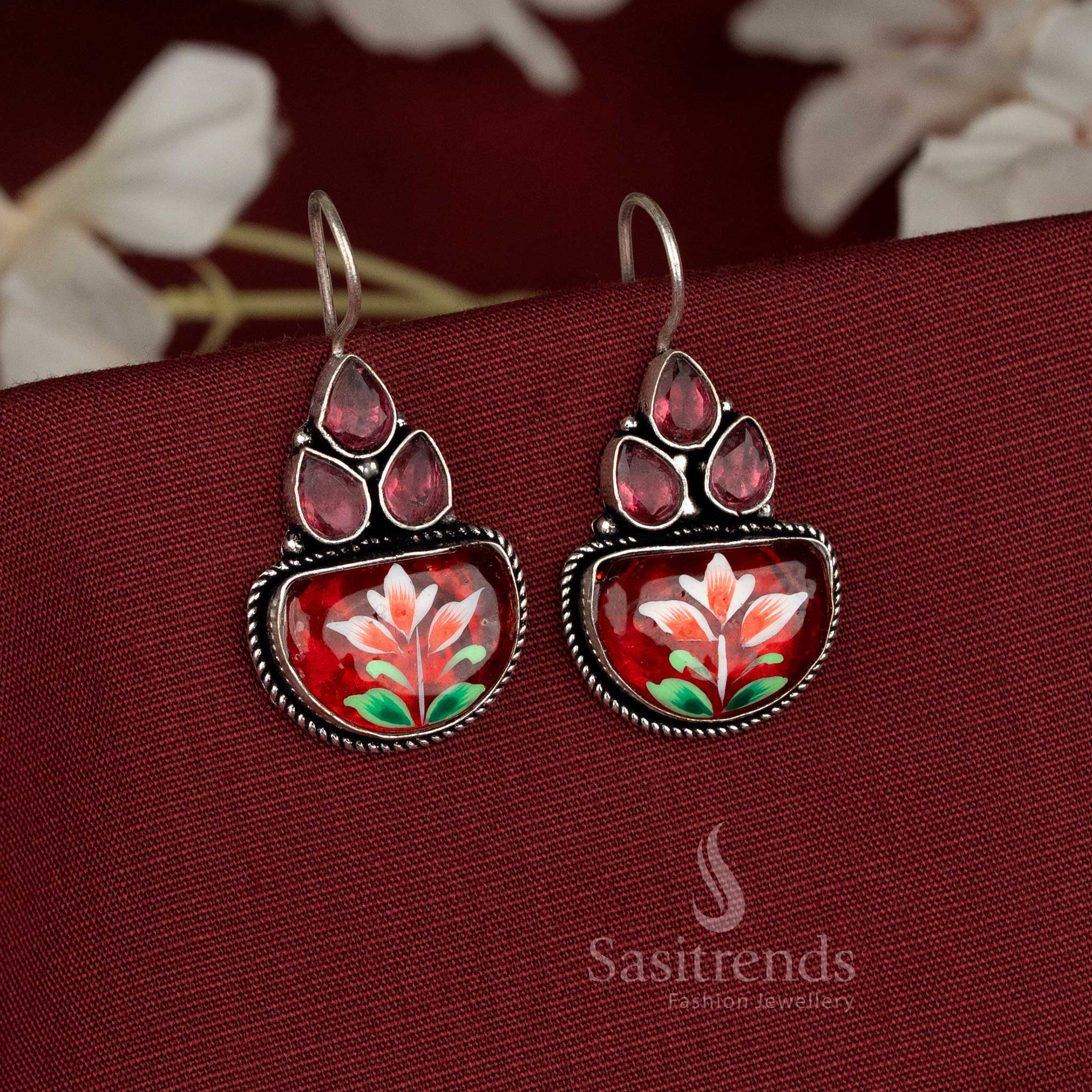 Red garden earrings presenting red Monalisa stone floral clusters atop oxidised frames for stunning festive presence – Sasitrends