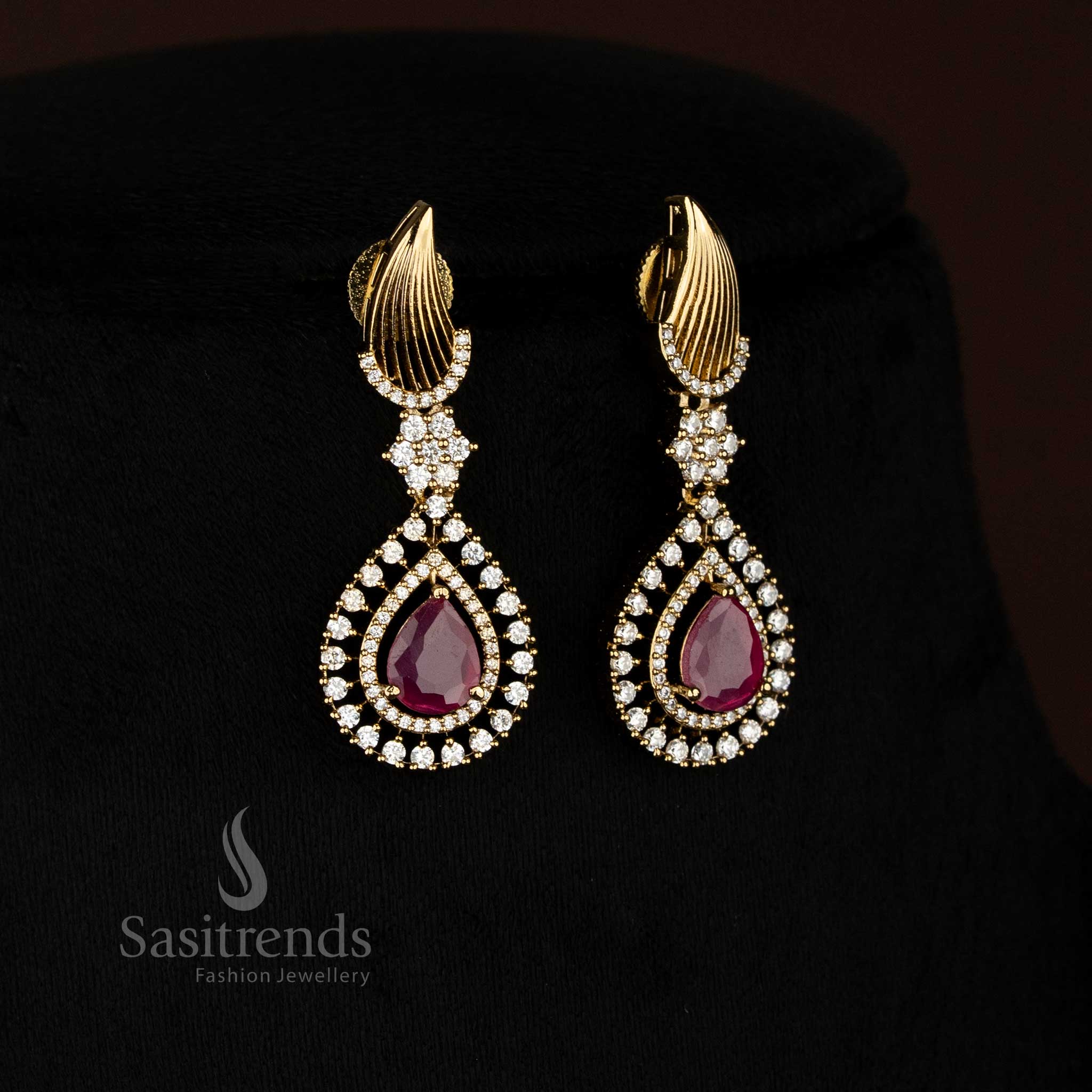 Ruby Ivory Blend mehendi gold plated white-ruby American Diamond drop earrings crafted for lively party fashion and elegant evening looks – Sasitrends