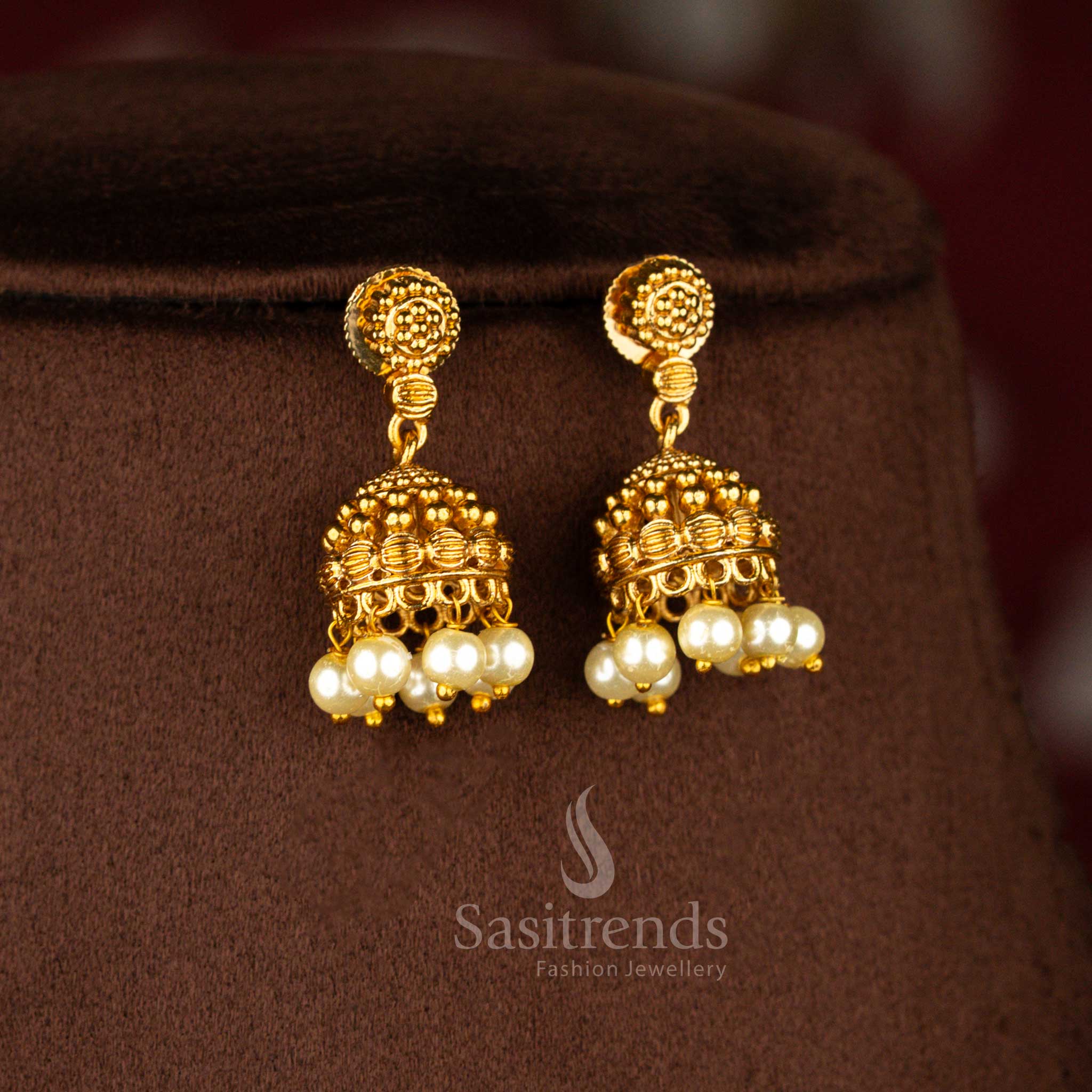 Temple matte gold plated jhumka earrings designed with classic dome detailing for women traditional wear – Sasitrends