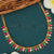 Elegant Micro Gold-Plated Necklace with Tilak Design Stones and American Diamond Embellishments