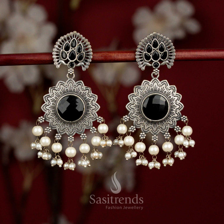 Bold antique oxidised silver earrings crafted with black Monalisa stones, dramatic peacock feather sunburst motif and pearl drops for standout styling - Sasitrends