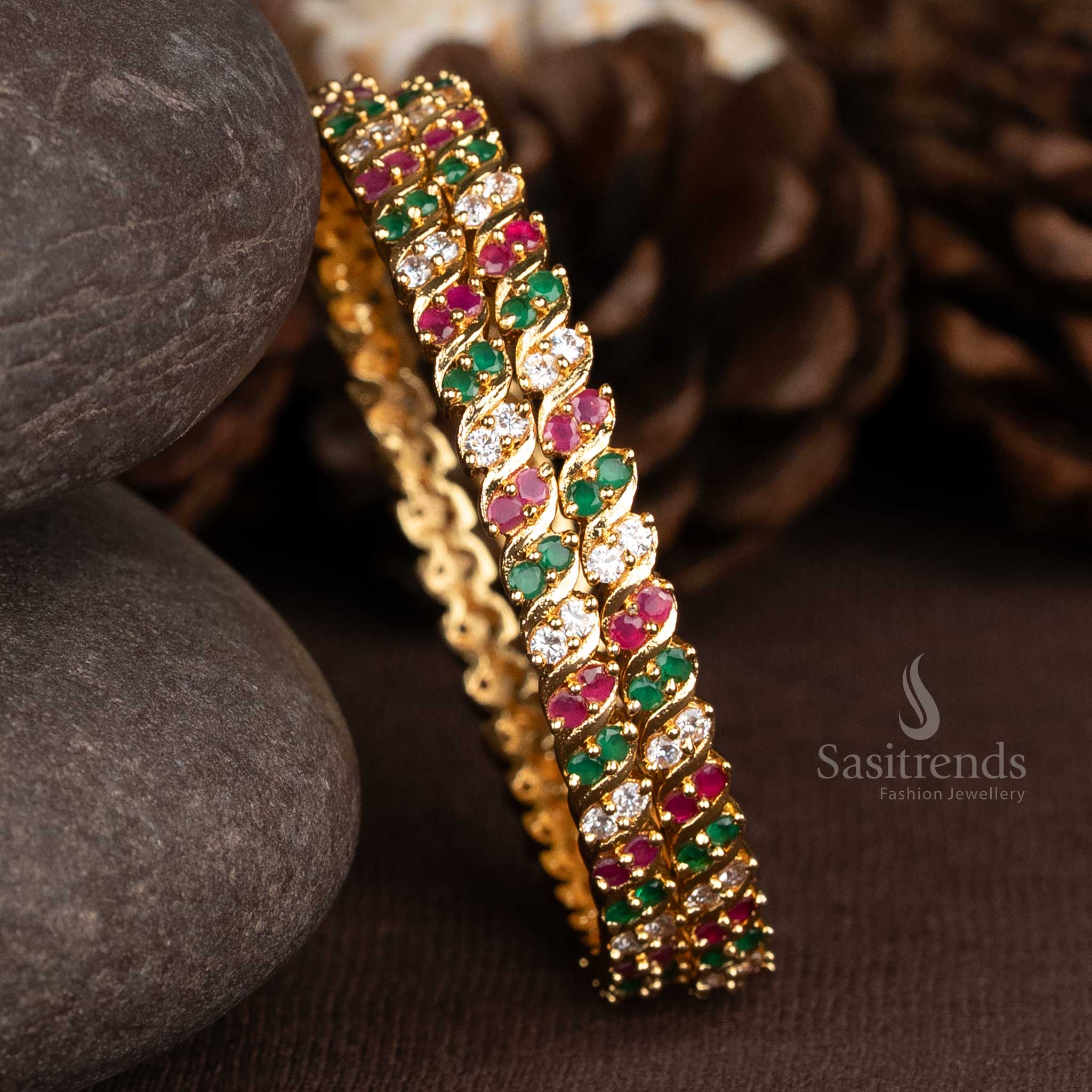 Dazzling spiral two line bangles in one gram gold finish, studded with multi-coloured American diamonds for a vibrant and opulent festive appeal – Sasitrends