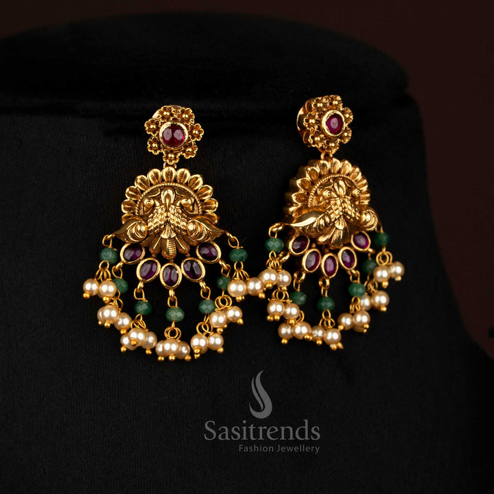 Elegant ruby premium matte gold plated dual peacock floral earrings featuring pearl hangings, perfect to wear for cultural ceremonies and sacred temple events – Sasitrends