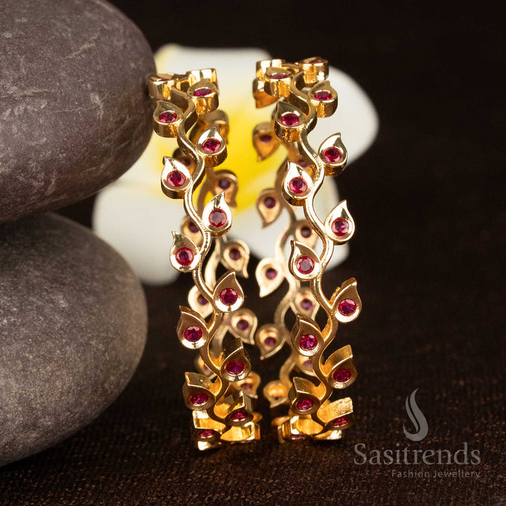 Sparkling ruby leaf patterned micro gold plated bangles with shining American diamond stones for luxurious elegance - Sasitrends