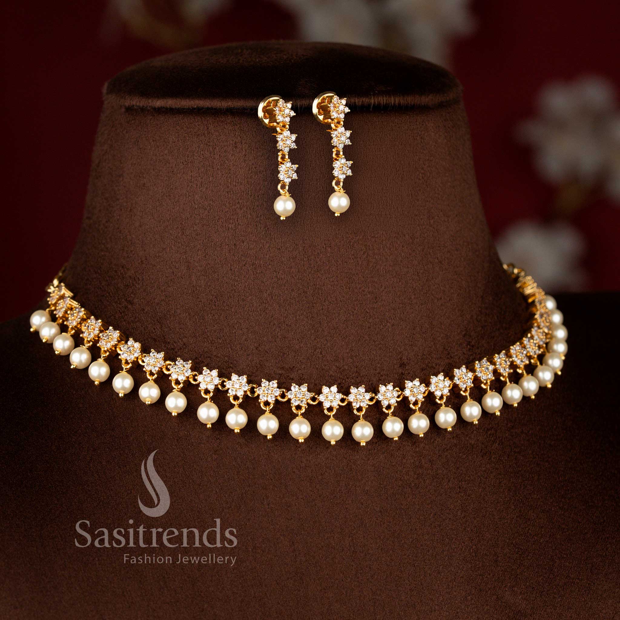 Luminous micro gold plated AD star floral necklace in white featuring delicate pearl drops, 24 carat gold shine – Sasitrends