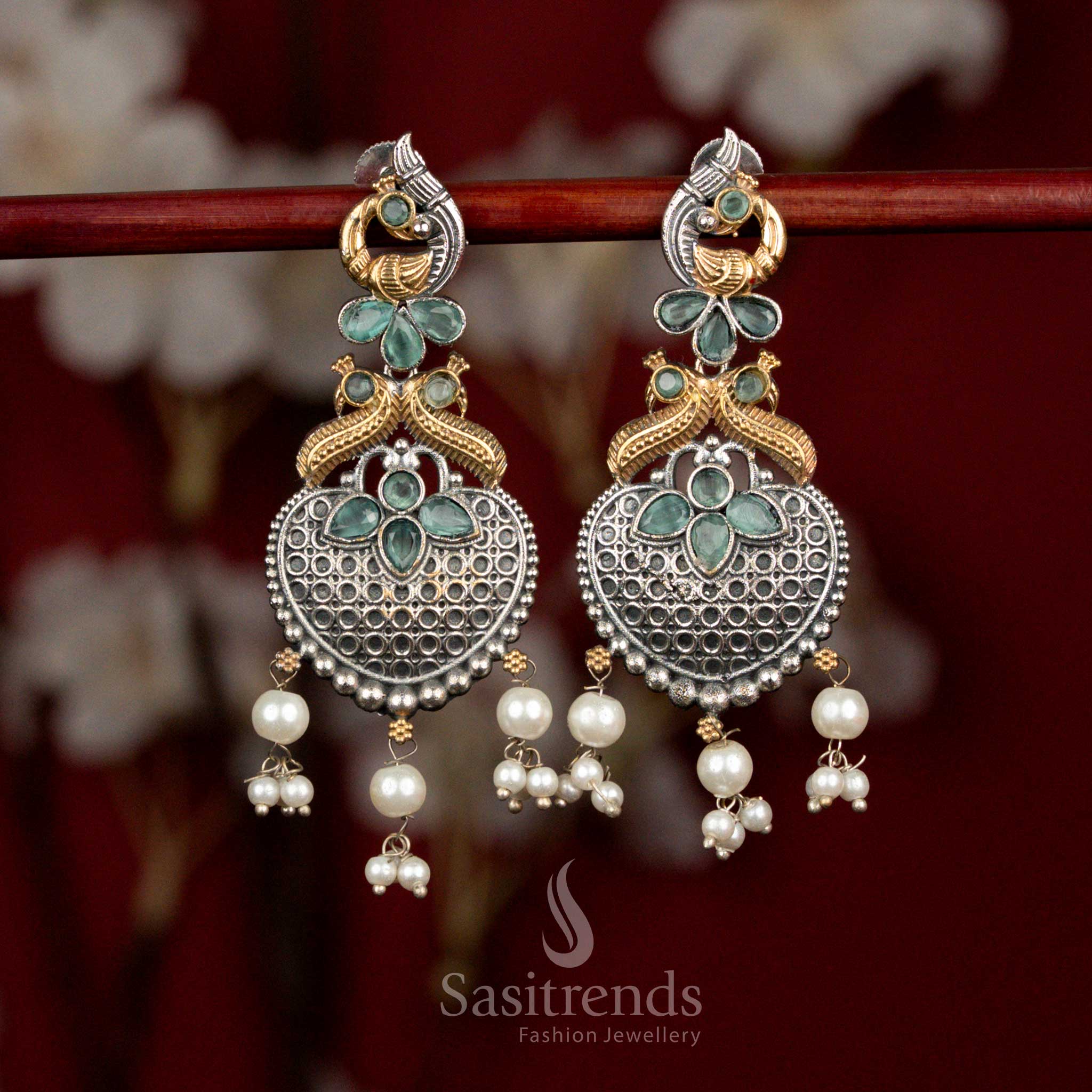 Fresh mint Monalisa stone oxidised silver earrings with dual tone peacock heart motifs and pearl hangings for elegant party styling - Sasitrends
