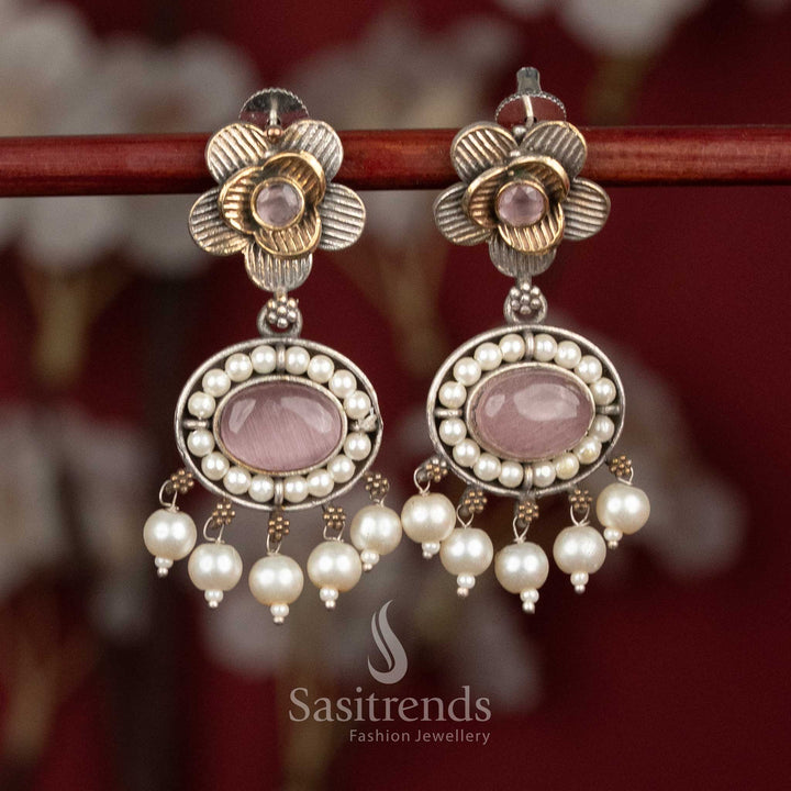Antique oxidised silver floral studs featuring pink Monalisa stones, intricate floral detailing and pearl drops for graceful festive wear - Sasitrends