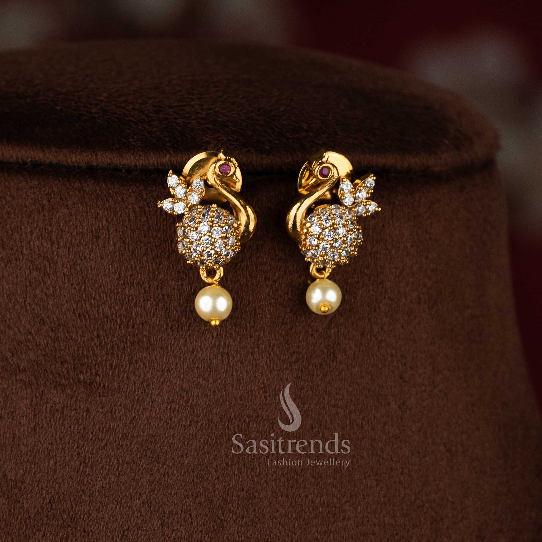 Radiant white designer peacock feather AD earrings with matte gold plating, elegant jewellery for festive occasions - Sasitrends