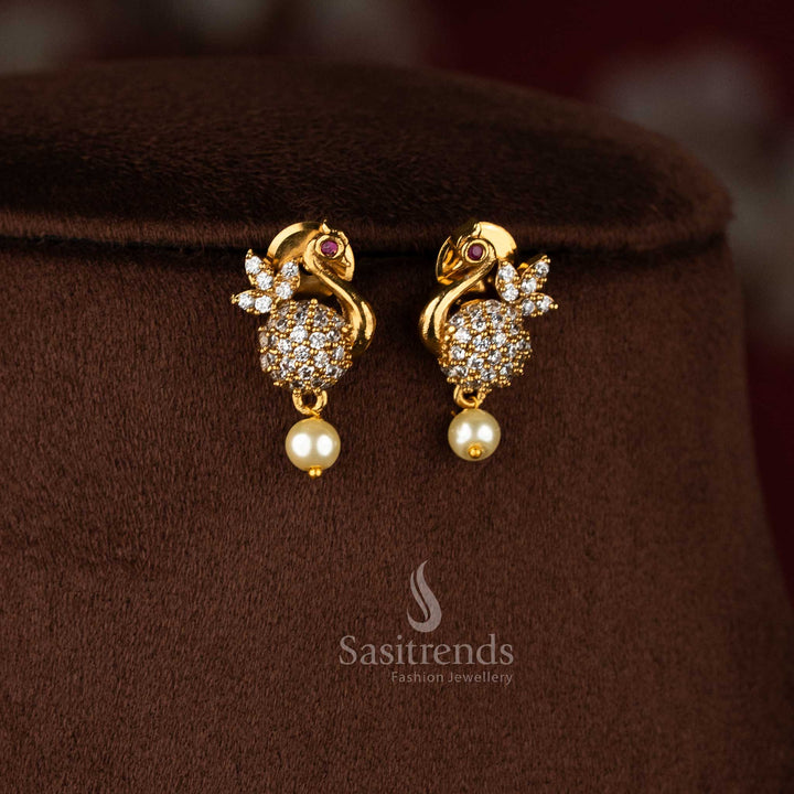 Radiant white designer peacock feather AD earrings with matte gold plating, elegant jewellery for festive occasions - Sasitrends