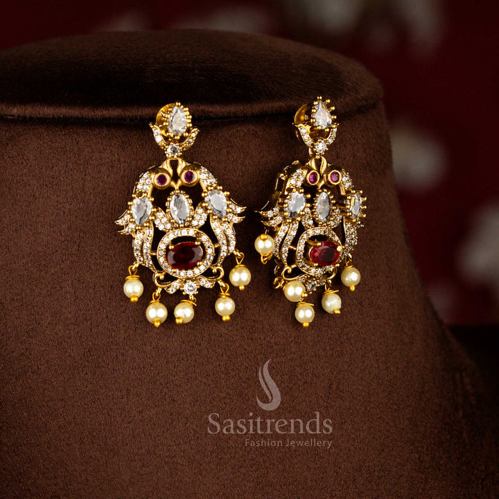 Royal blossom American diamond peacock themed earrings finished in matte gold with pearl drops and white red stone highlights – Sasitrends